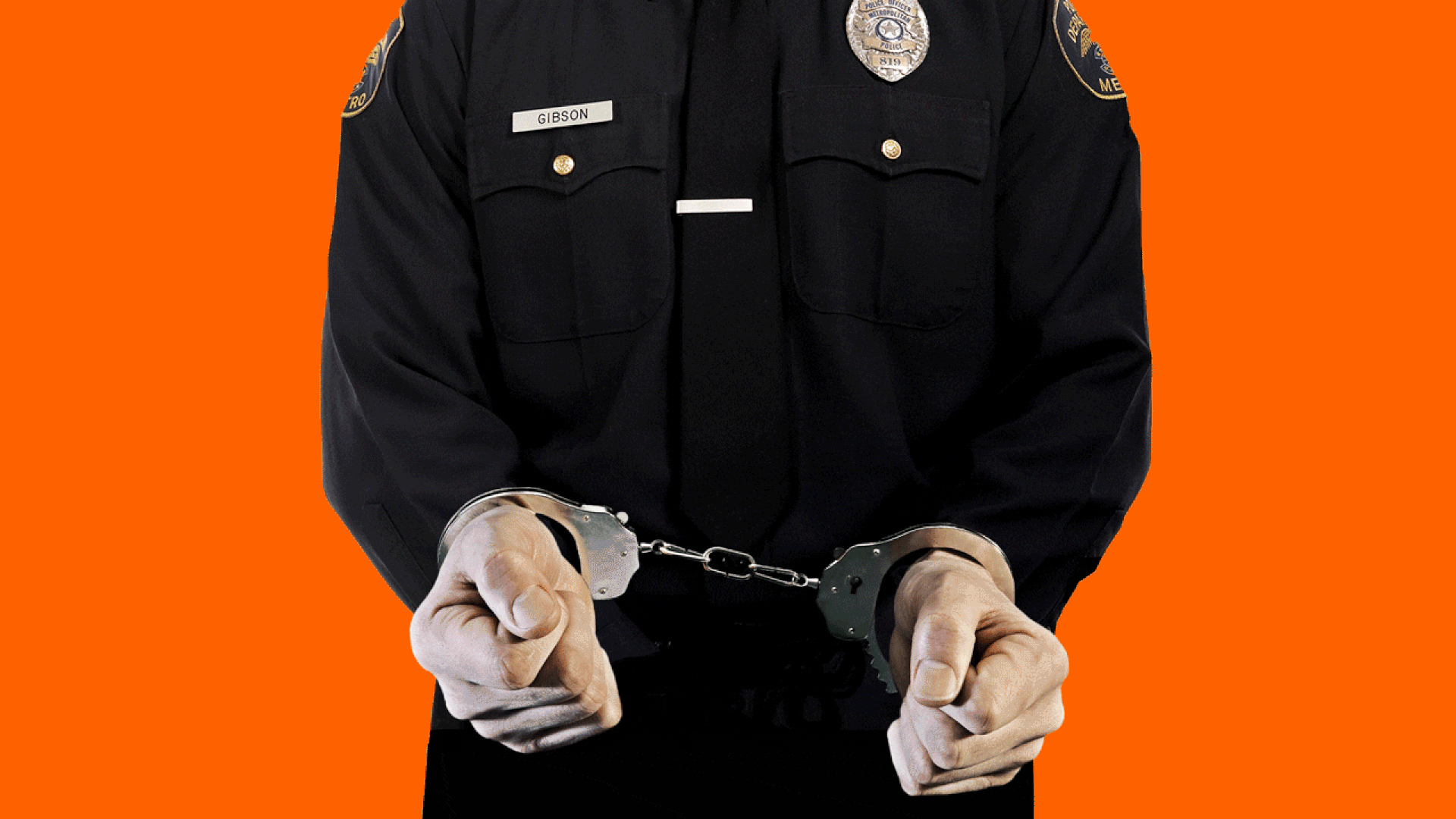 Animated illustration of a policeman's fists with handcuffs that fade until they disappear