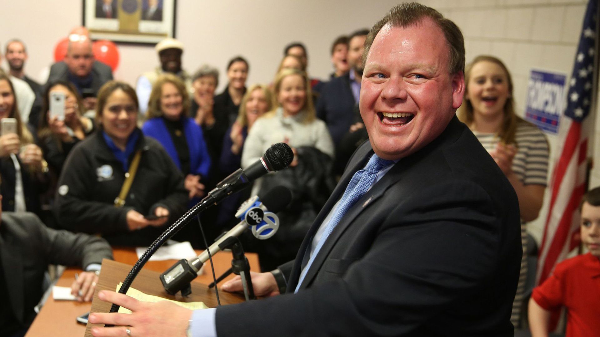 Photo of a man at a podium. 