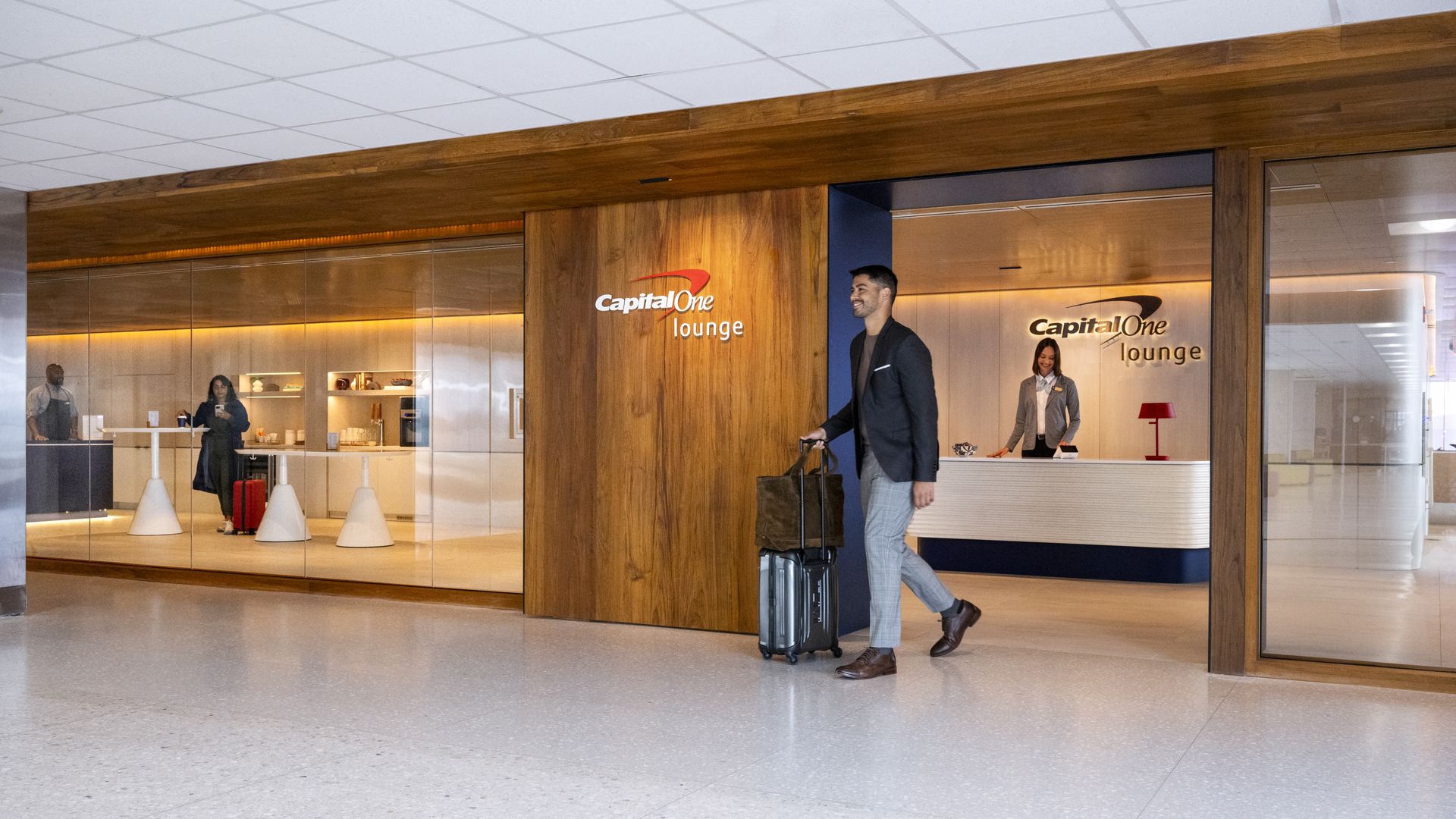 An airline traveler exits the Capital One lounge