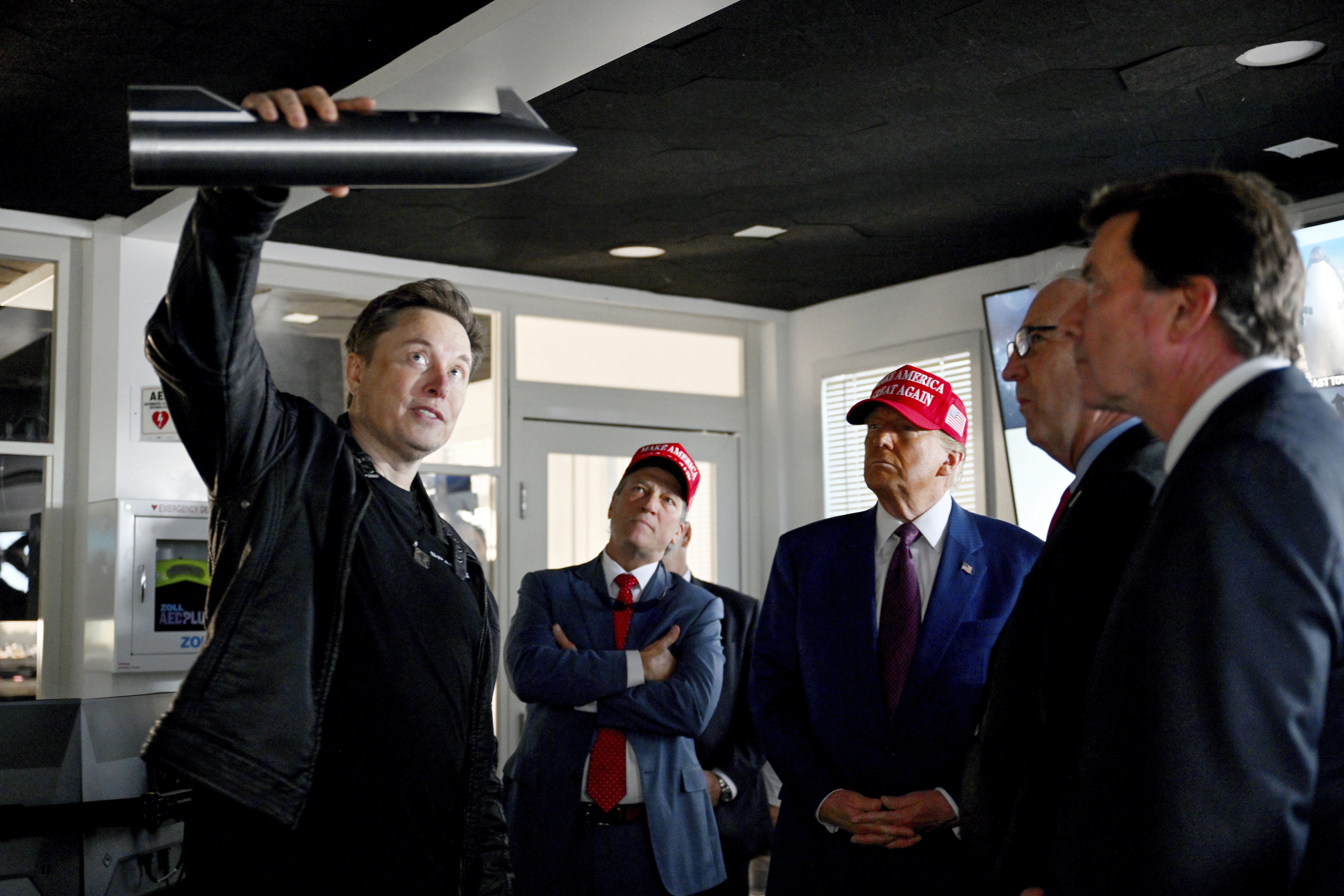 President-elect Donald Trump listens as Elon Musk explains the operations ahead of the launch of the sixth test flight of the SpaceX Starship rocket Tuesday, Nov. 19, 2024 in Boca Chica, Texas. (Brandon Bell/Pool via AP)