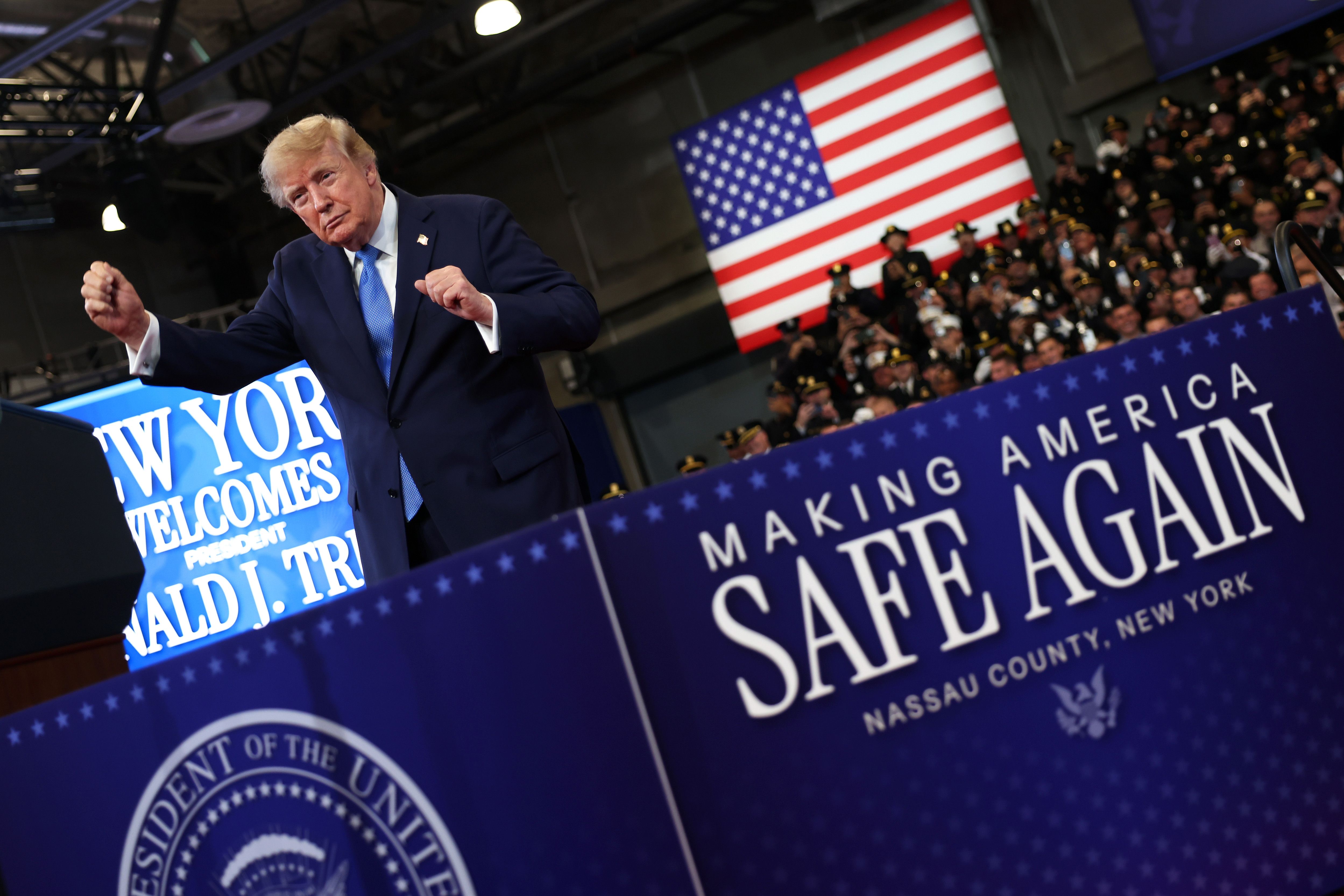 President Donald Trump dances after delivering remarks at the David S. Mack Center for Training and Intelligence on August 14, 2026 in Garden City, New York. President Trump visited the police academy to highlight the FBI's 2025 Crime Statistics Report and rally support for local Republican candida