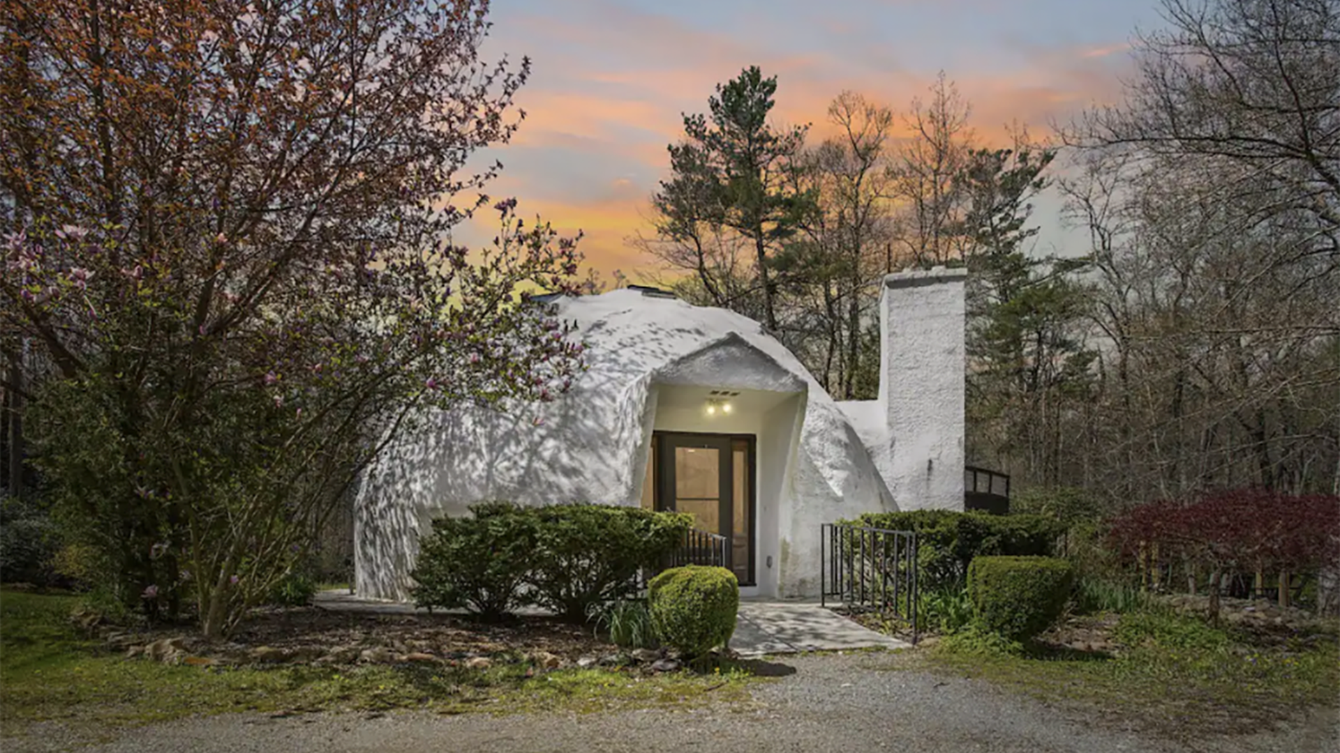 white dome home in the woods