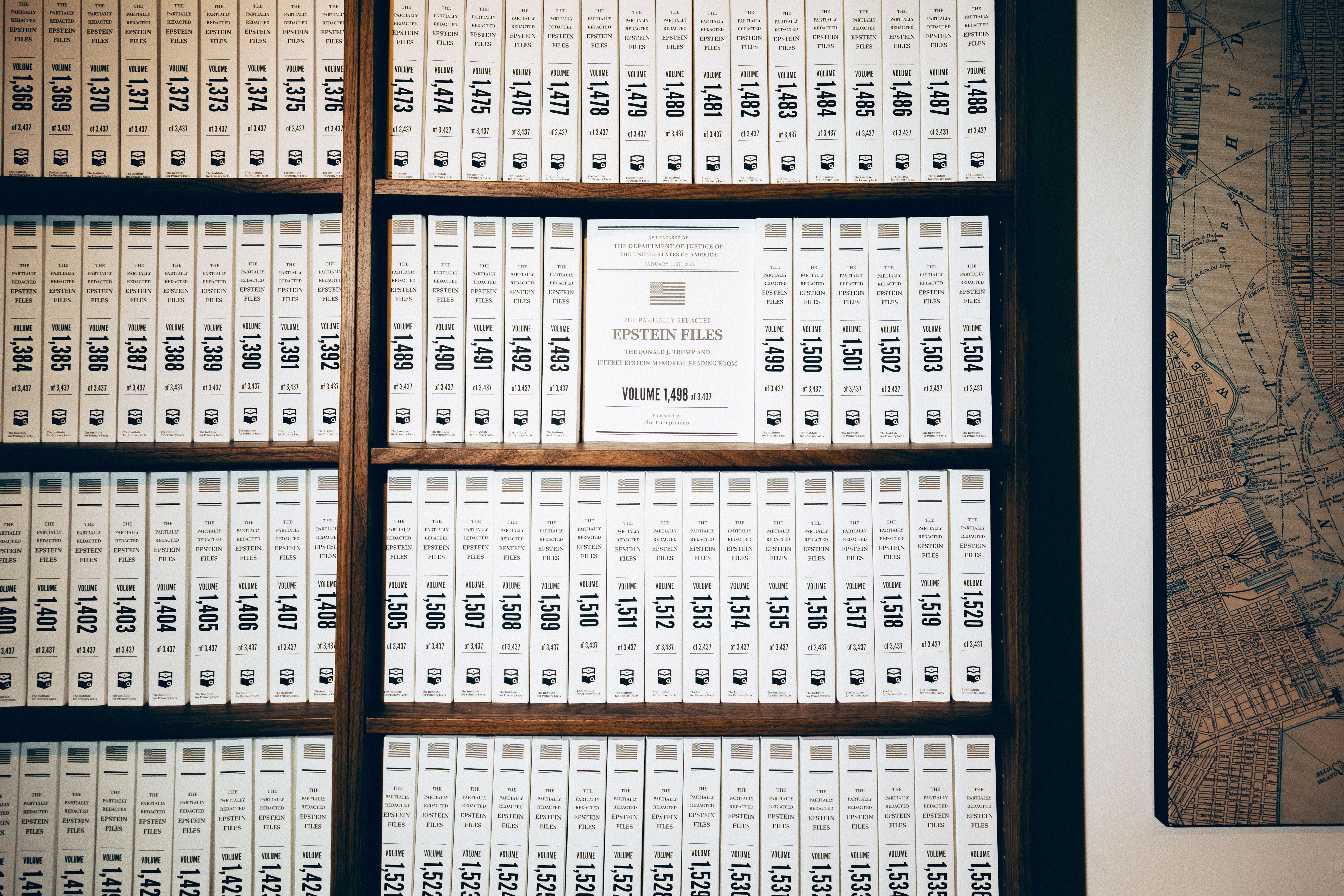 Bookshelves filled with millions of law enforcement documents related to the investigation of Jeffrey Epstein, printed and bound into 3,437 volumes, are displayed at an art gallery in the tribeca neighborhood of Manhattan on May 8, 2026. The exhibition has attracted a steady stream of visitors to 10