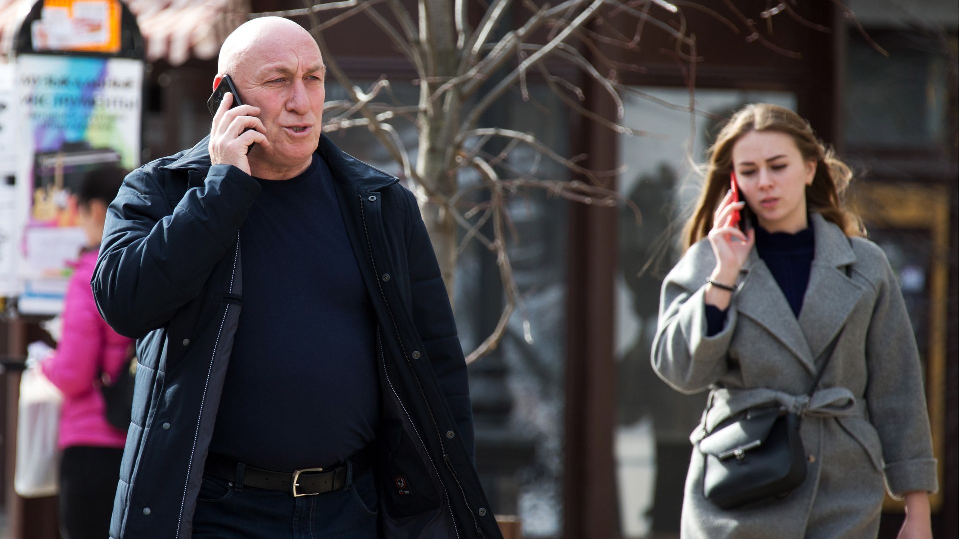 People talk on cell phones.