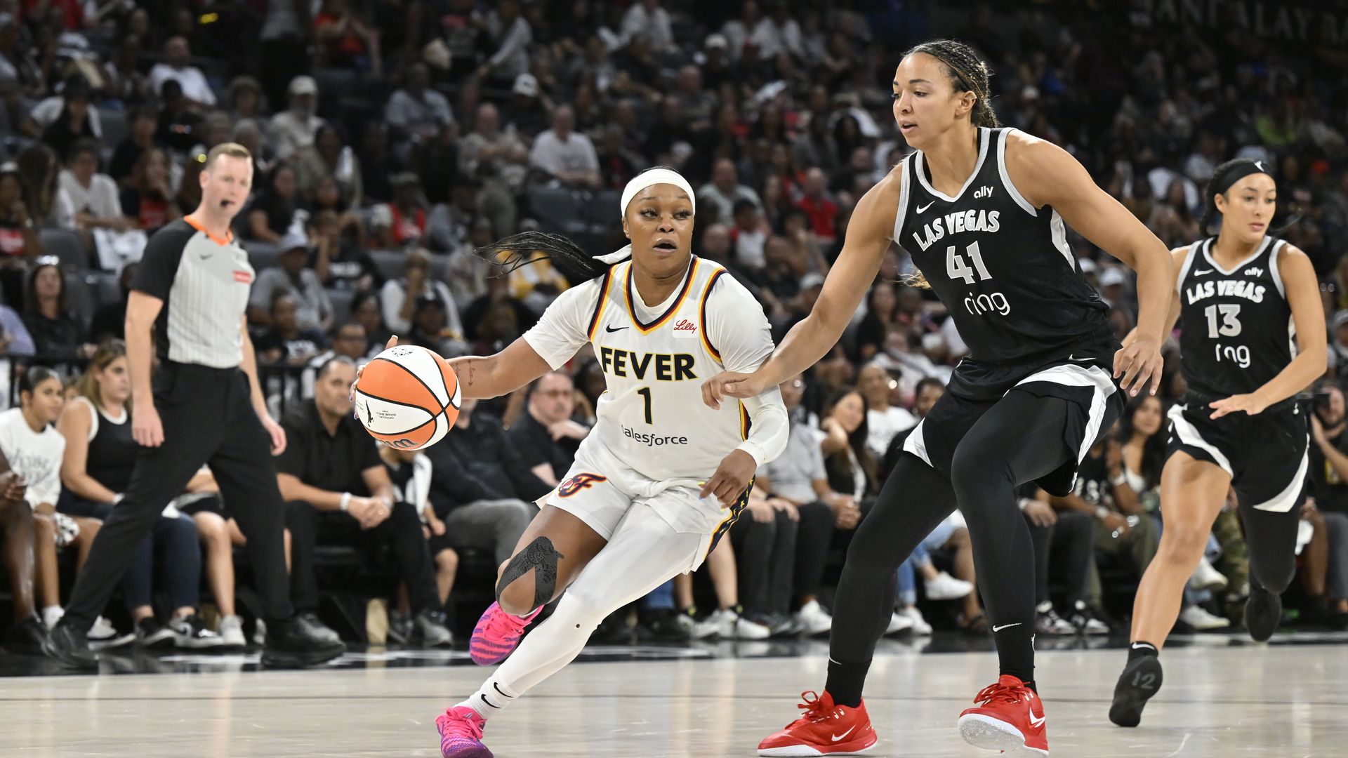 Odyssey Sims #1 of the Indiana Fever dribbles the ball during the game against the Las Vegas Aces on September 23, 2025 at Michelob ULTRA Arena in Las Vegas, Nevada.