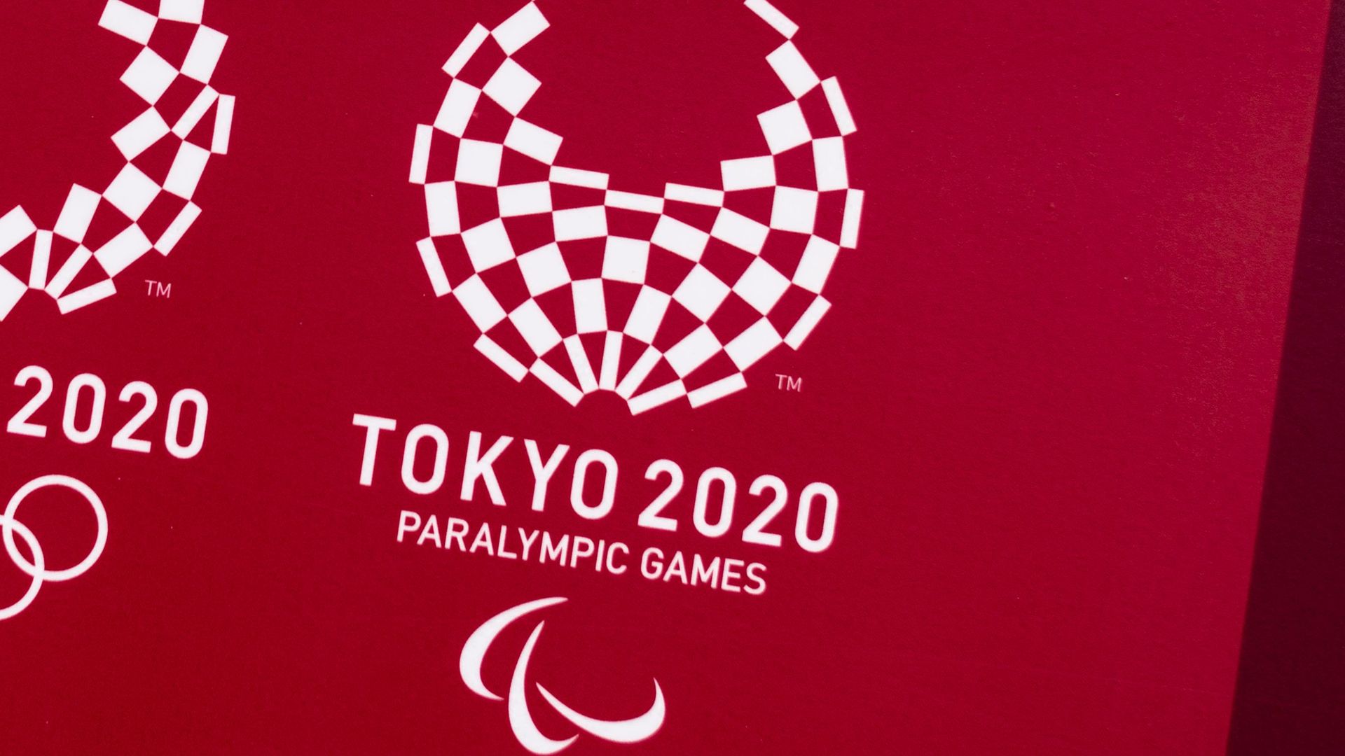 This picture shows the logos of the Tokyo 2020 Olympic and Paralympic Games in Tokyo on March 20,
