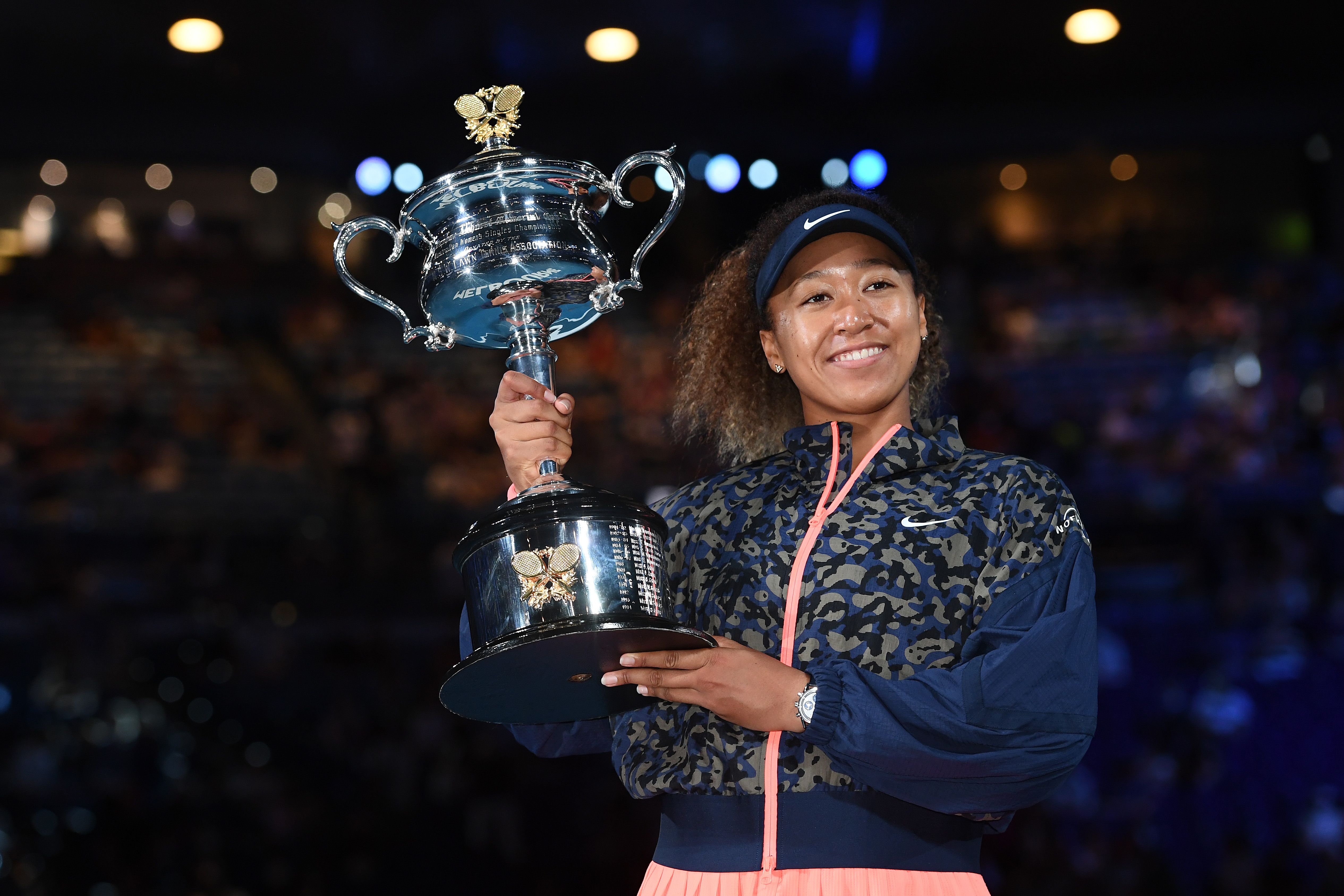 Naomi Osaka holds the trophy