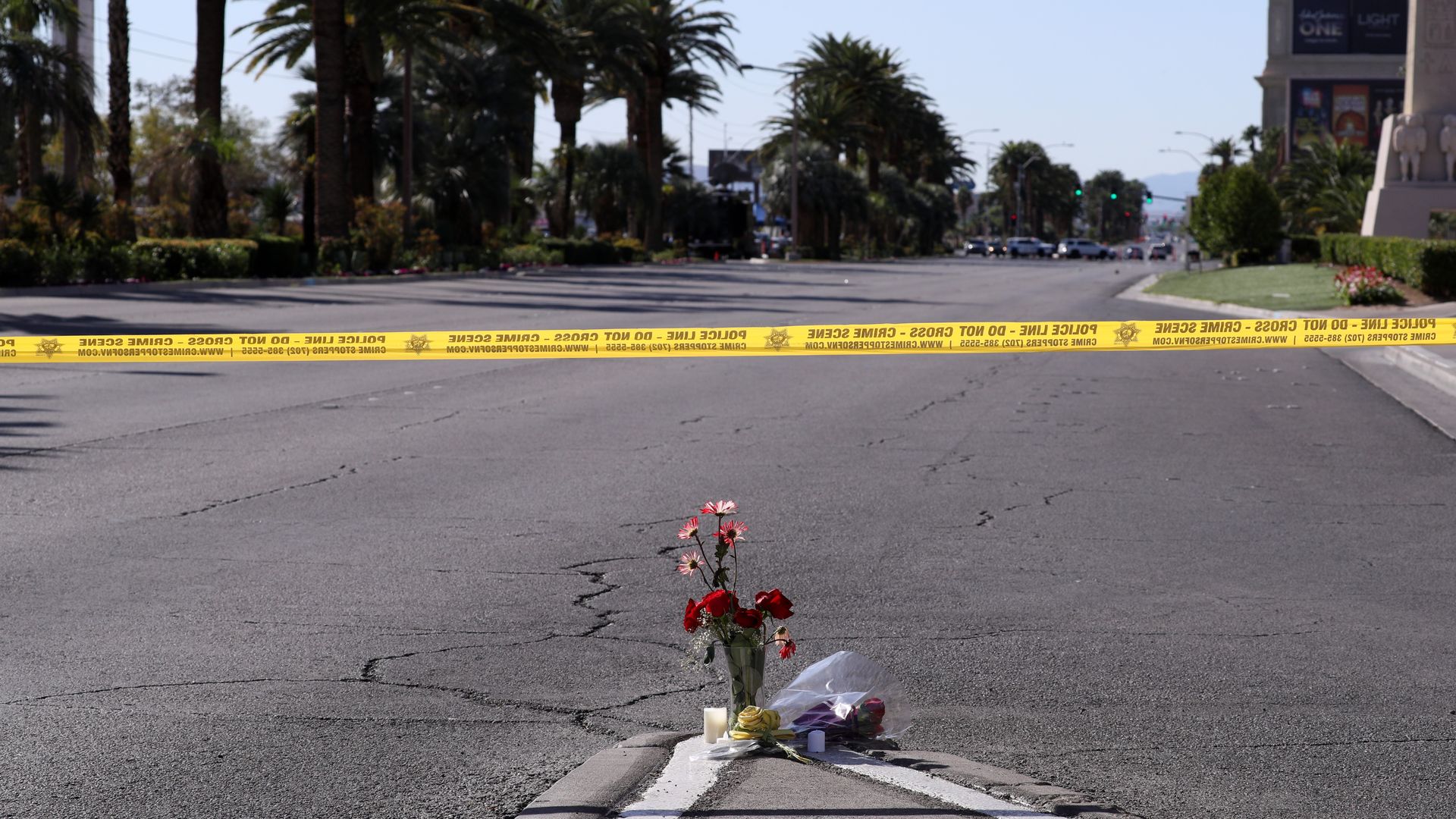 Flowers are placed as the FBI inspects the perimeters of Mandalay Bay Hotel after the attack in Las Vegas.