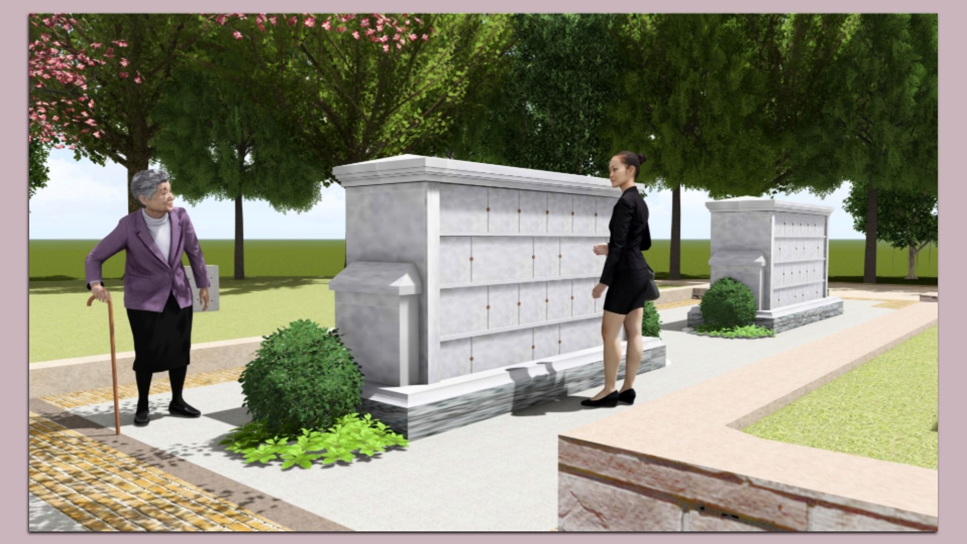 An elderly woman with a cane and a younger woman in black stand near white columbarium walls with niches in a green park with trees and shrubs under a clear sky.
