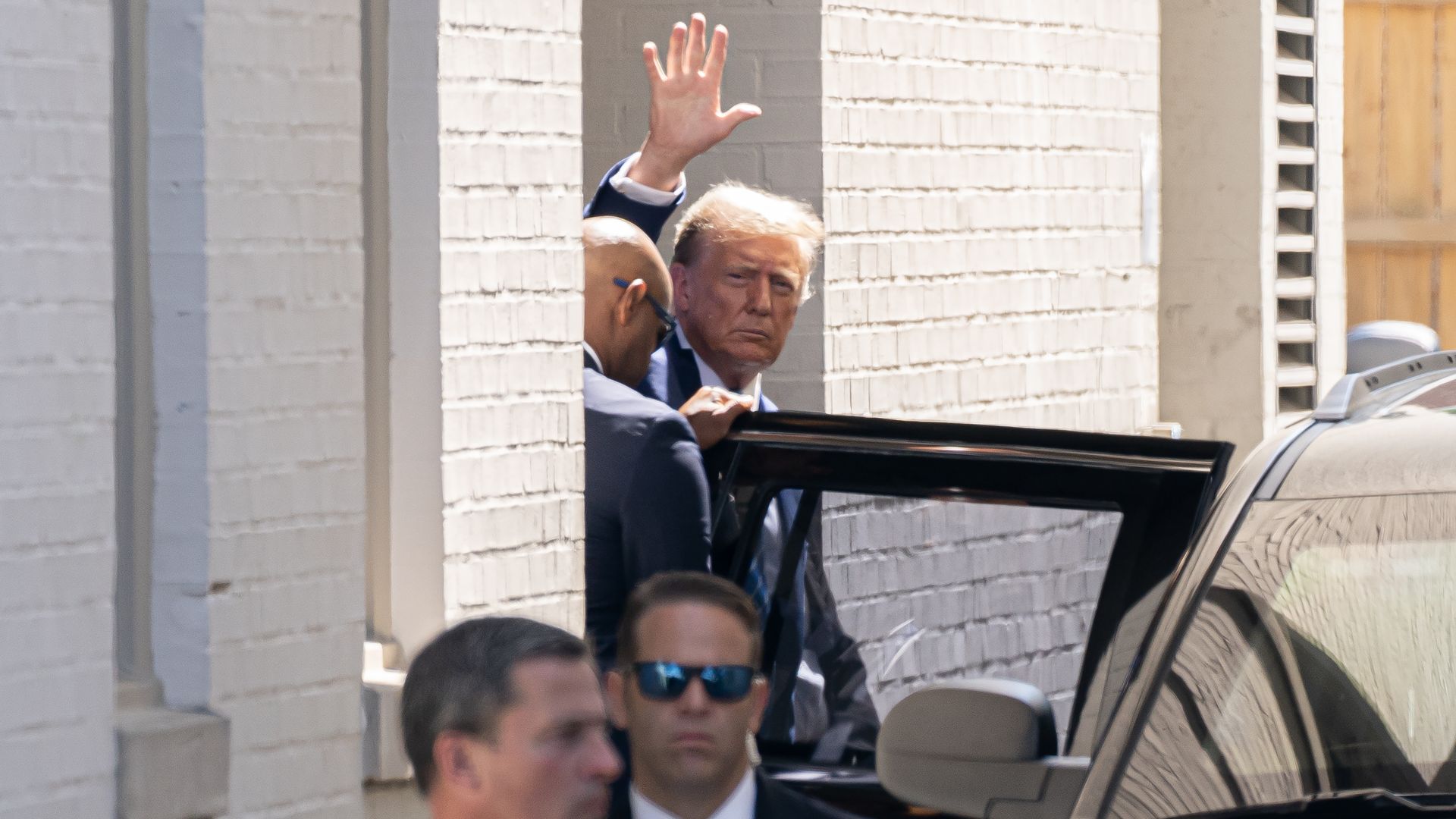Former U.S. President Donald Trump departs after delivering remarks at a House Republicans Conference meeting at the Capitol Hill Club
