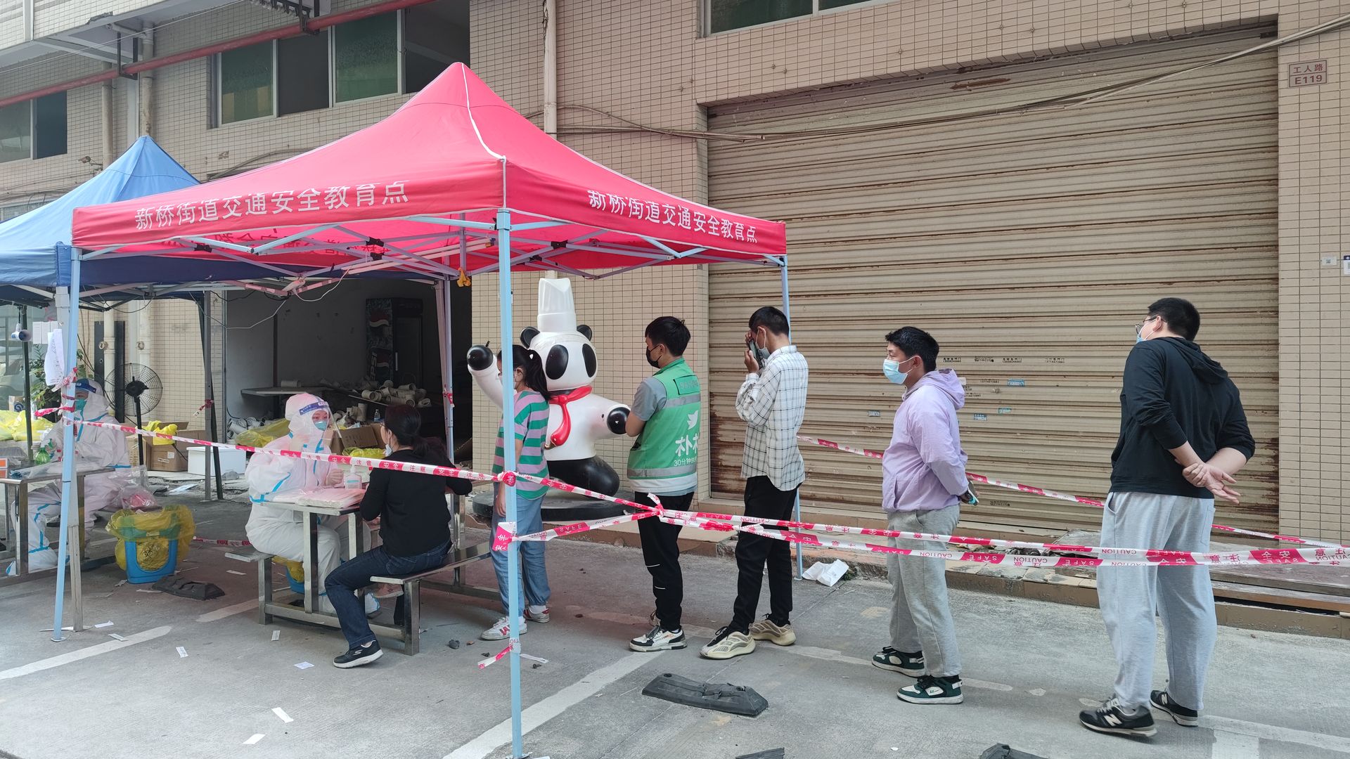 Local residents queue up for COVID-19 nucleic acid tests on March 13, 2022 in Shenzhen, Guangdong Province of China.