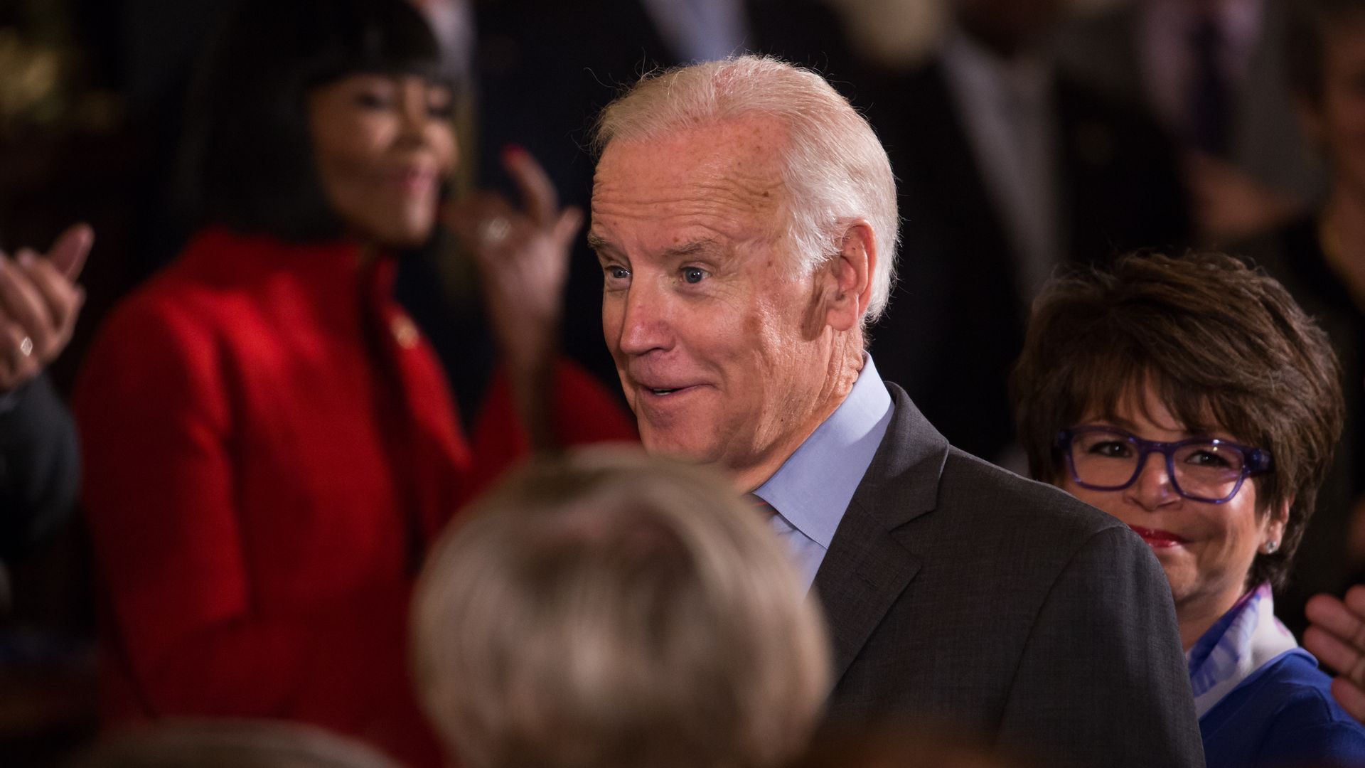 Joe Biden stands in the foreground with Valerie Jarrett behind him in a 2016 photo