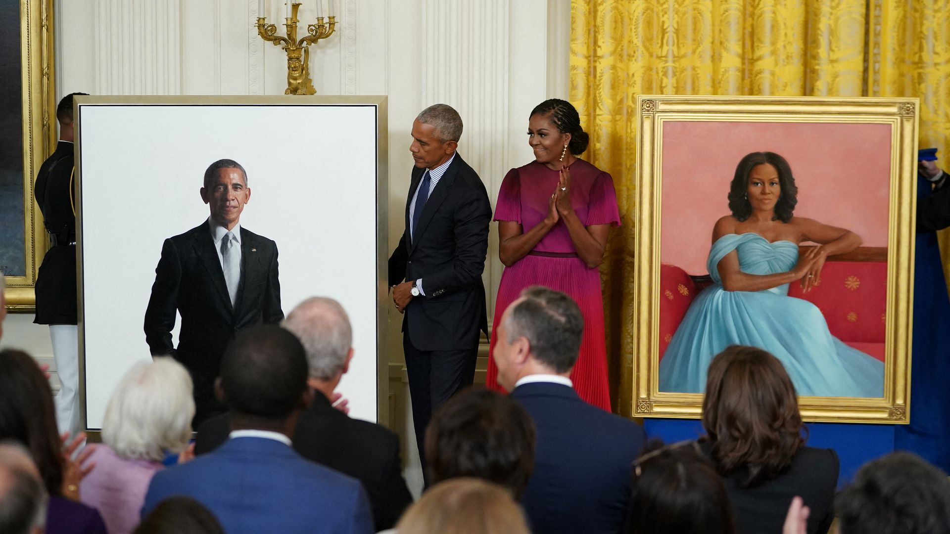 Former president Barack Obama and wife Michelle Obama stand by their official White House portraits after they were unveiled in the East Room