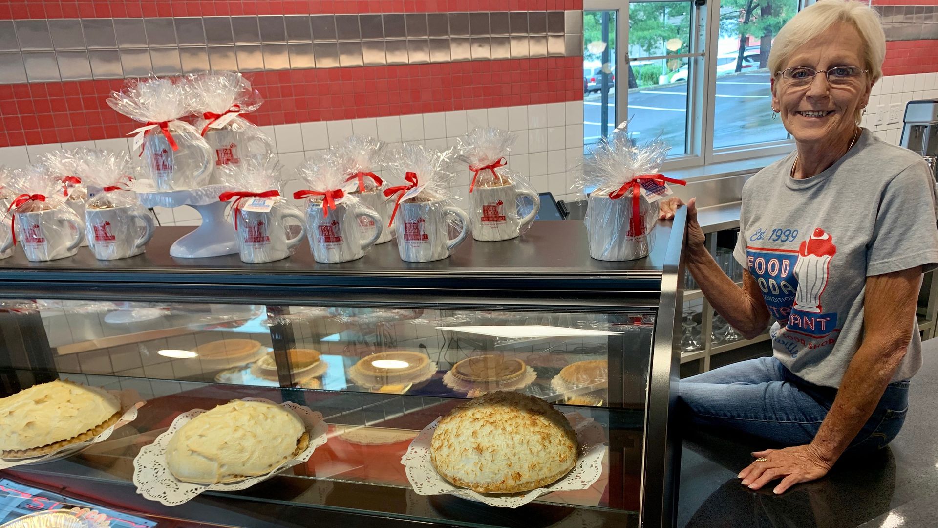 Pies in a dessert case.