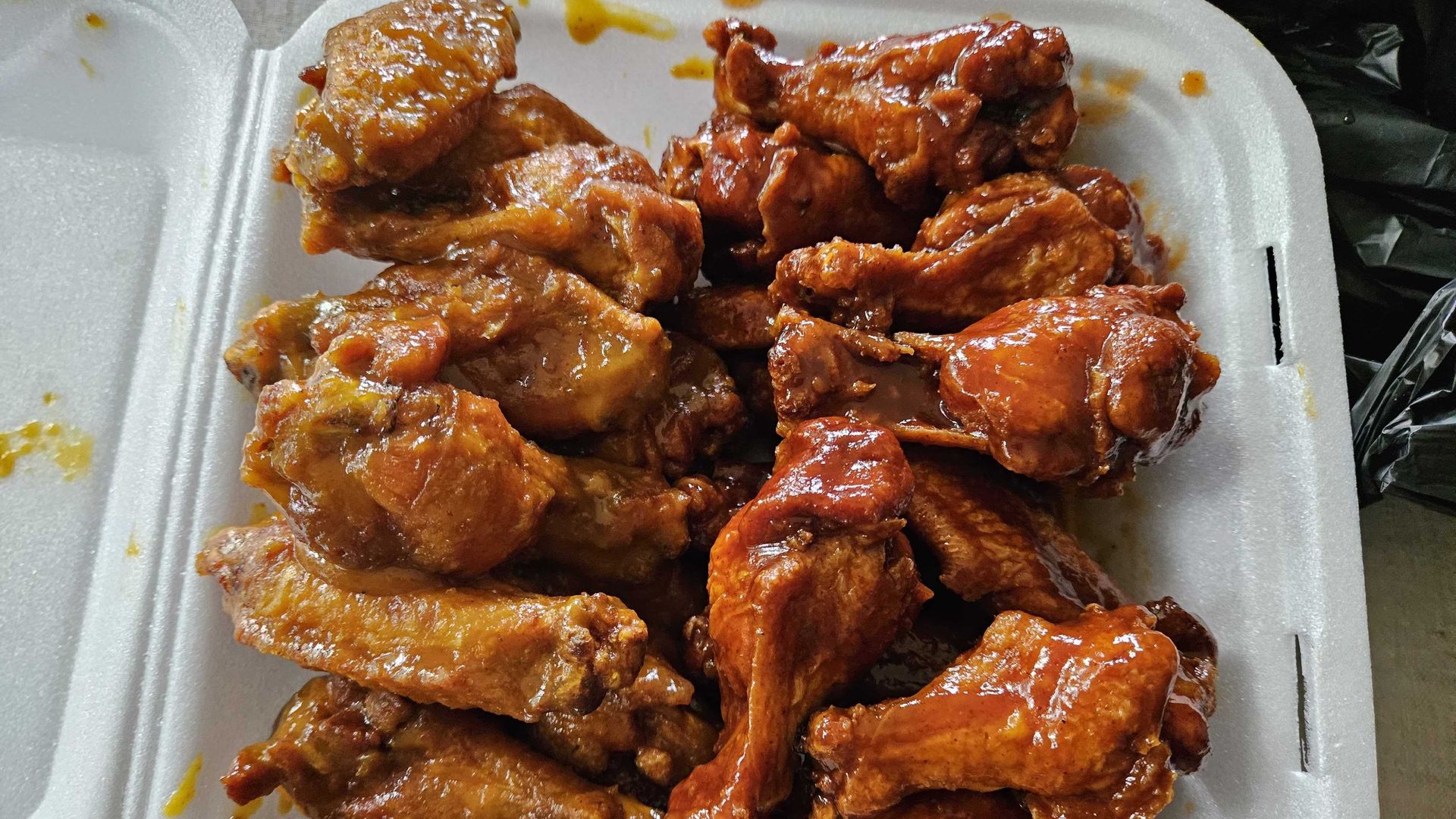 A tray piled with chicken wings.