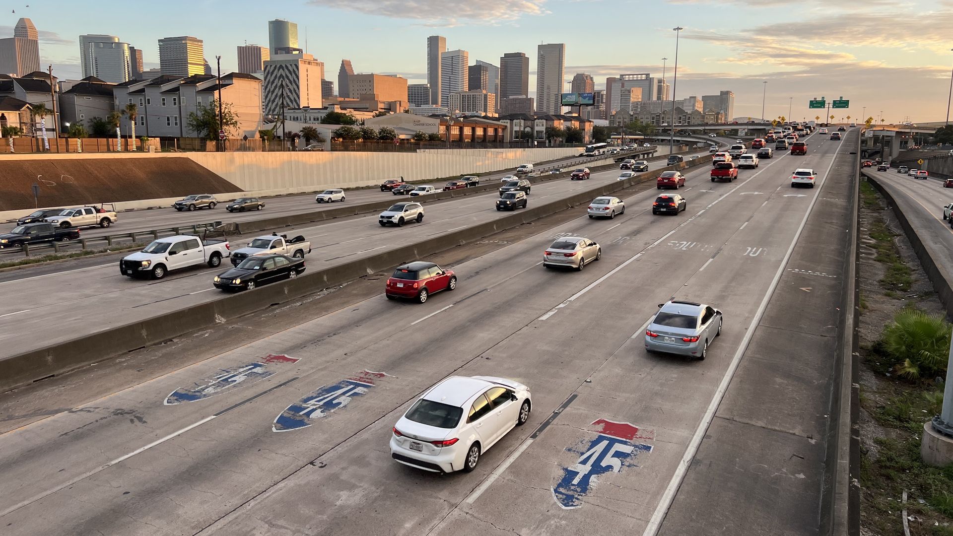 Drivers traverse a highway outside downtown Houston