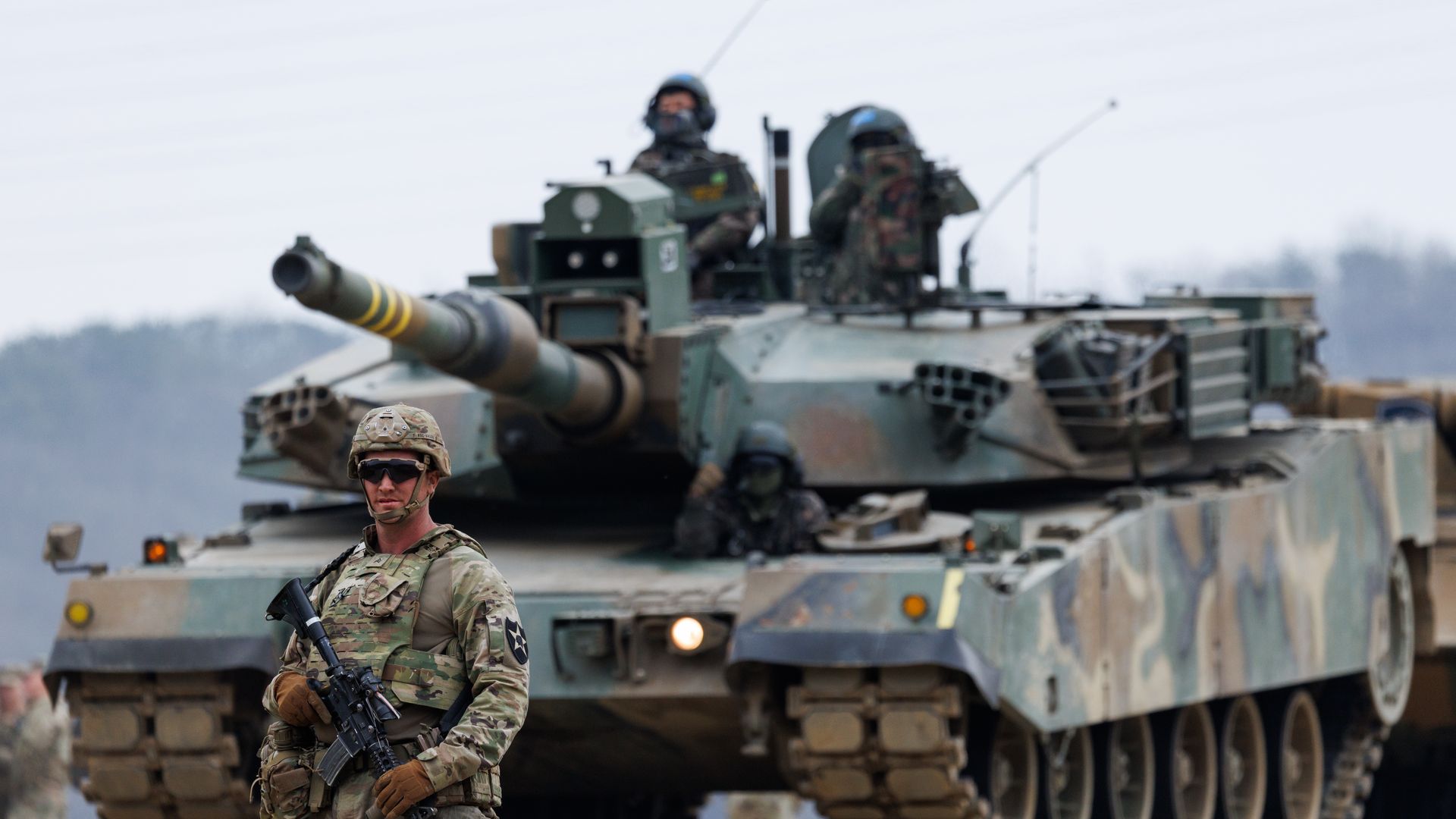 A U.S. soldier in combat gear moves through a river during a joint military exercise with South Korean troops in Yeoncheon.
