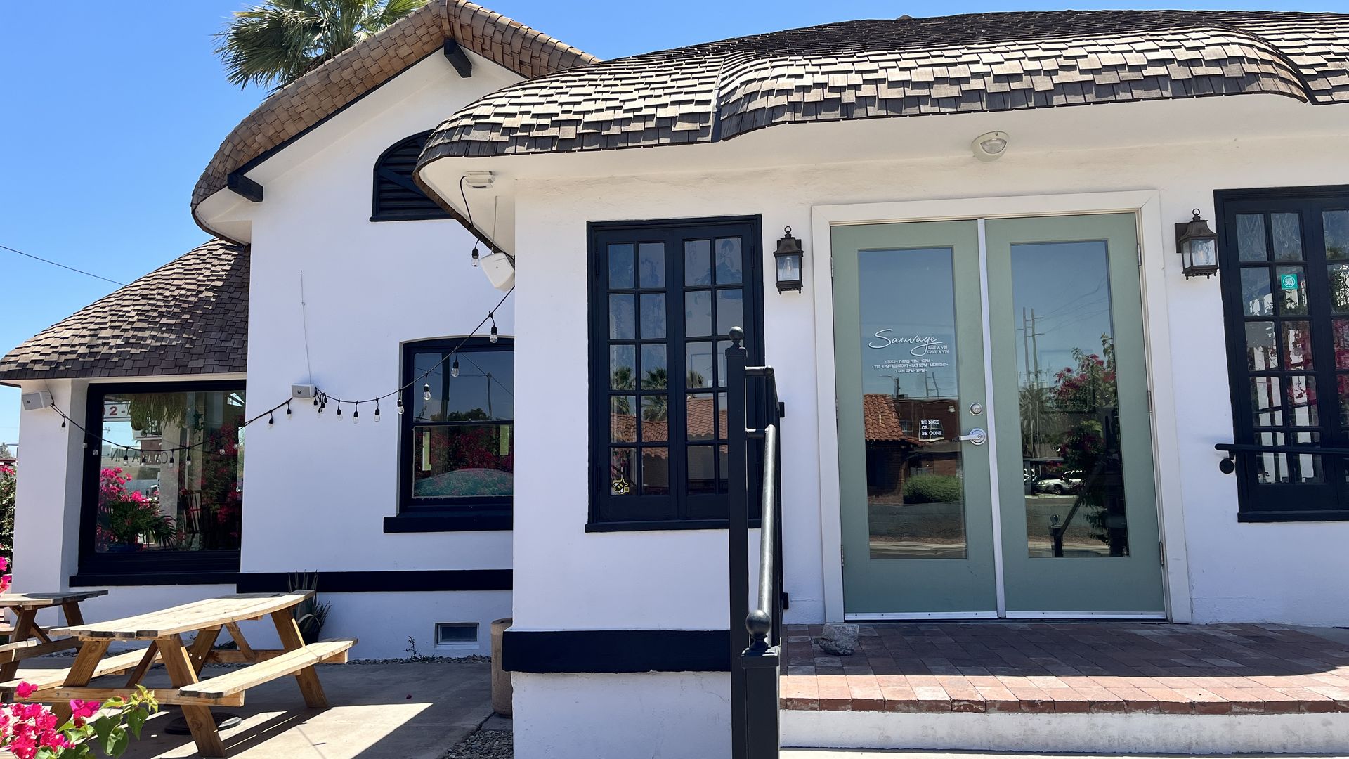 A cottage-style home with a green door.