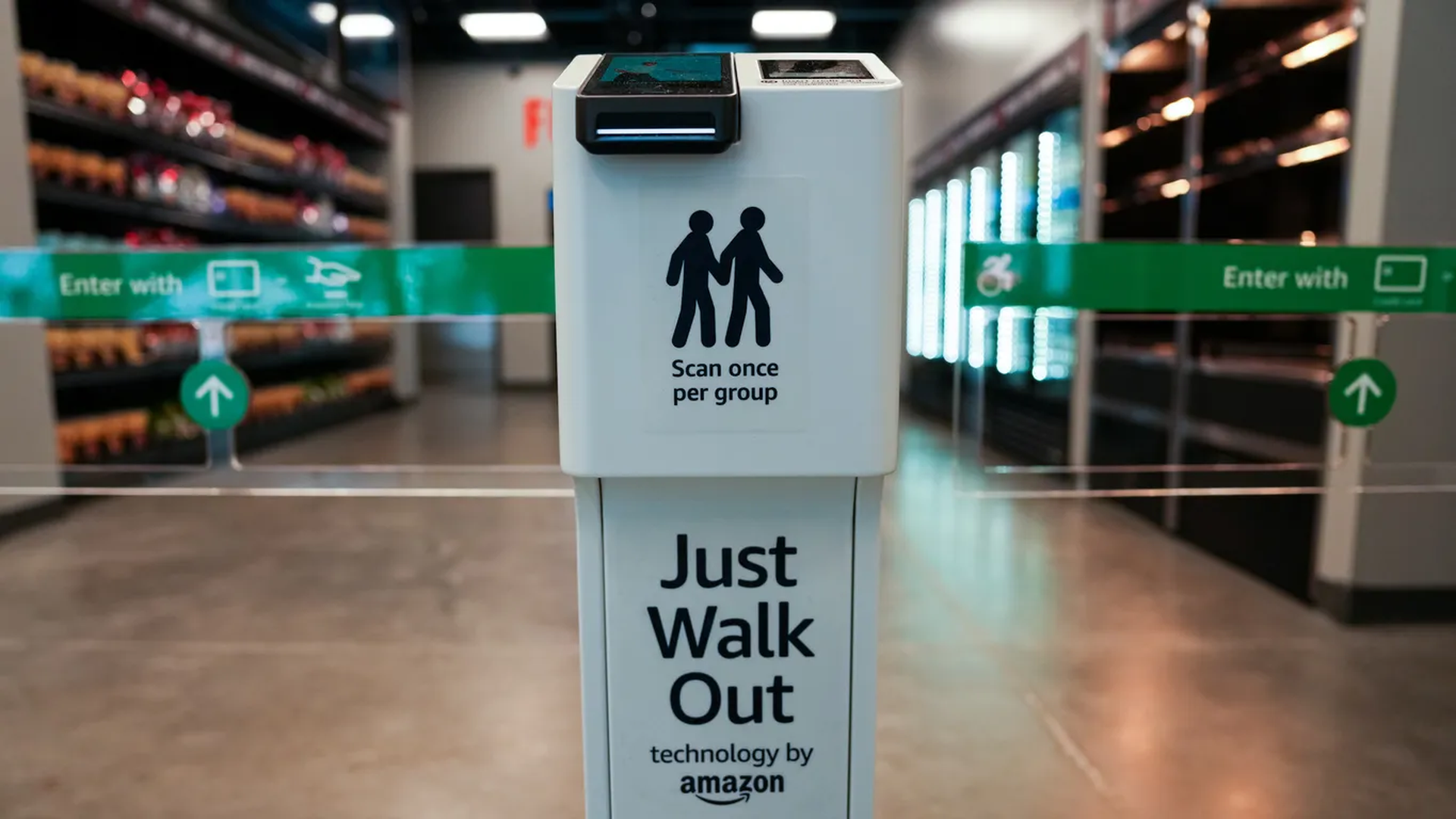 The entrance to an Amazon stadium store with an entry sign reading "Just Walk Out, technology by Amazon."