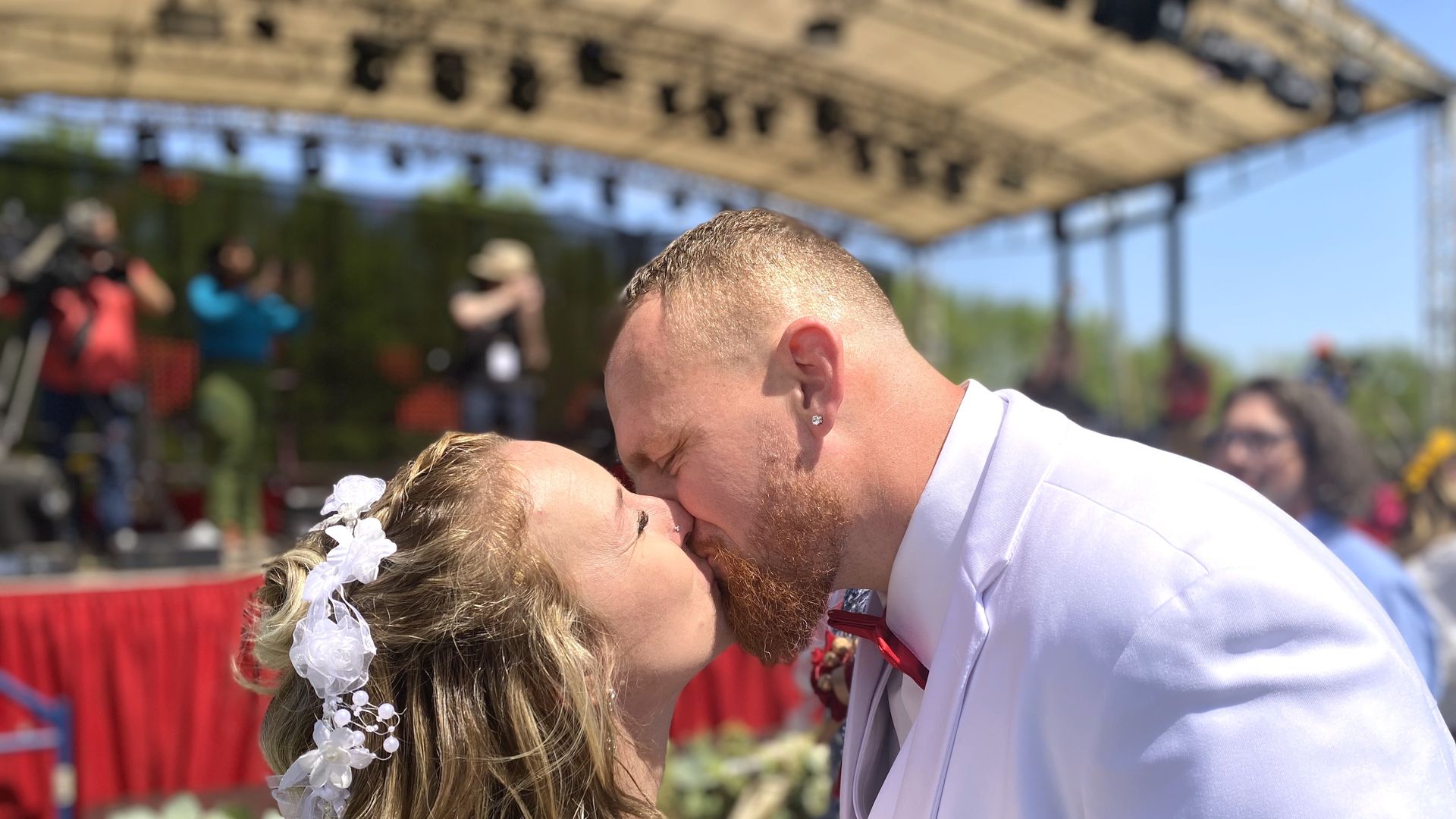 Michelle and Randy Weller kiss to seal their marriage just before the total eclipse in Russellville, Arkansas. They joined more than 100 other couples in a mass wedding. Time 1:38 pm CT.