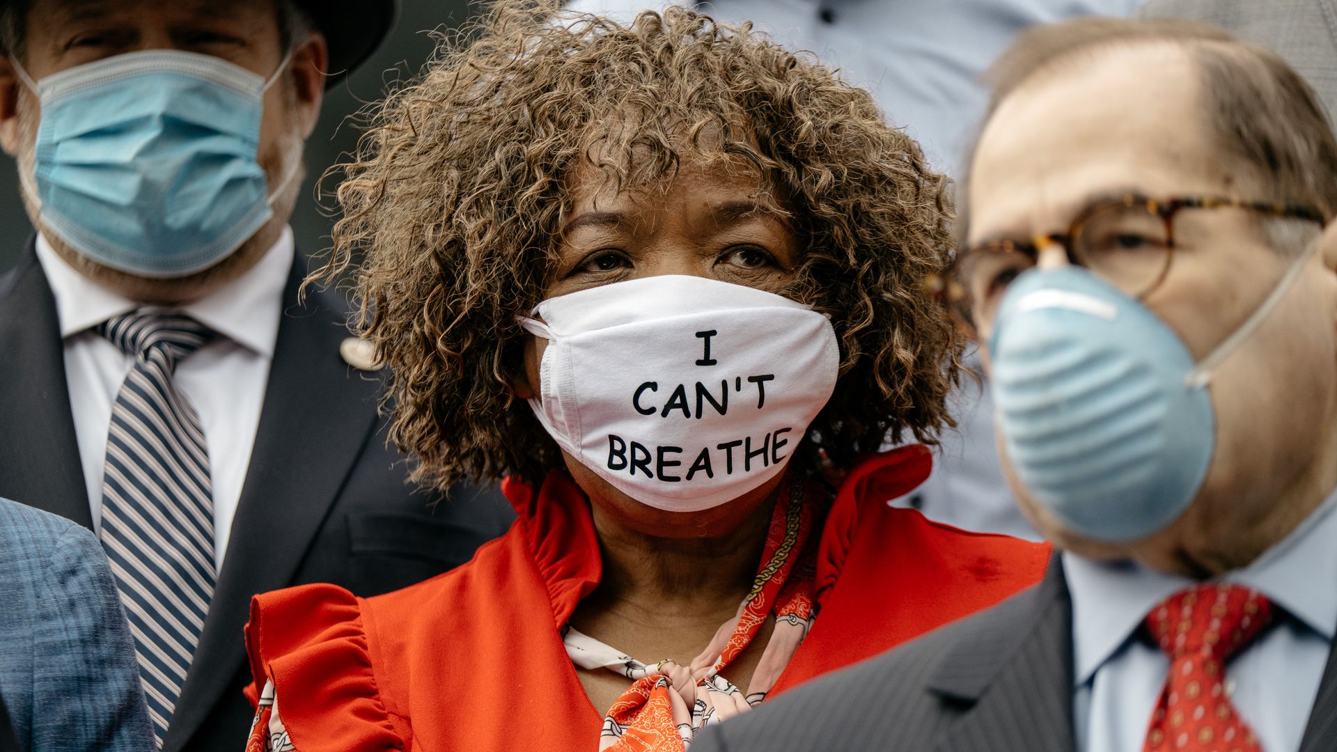 Eric Garner's mother wears a face mask with the words "I can't breathe" printed on it
