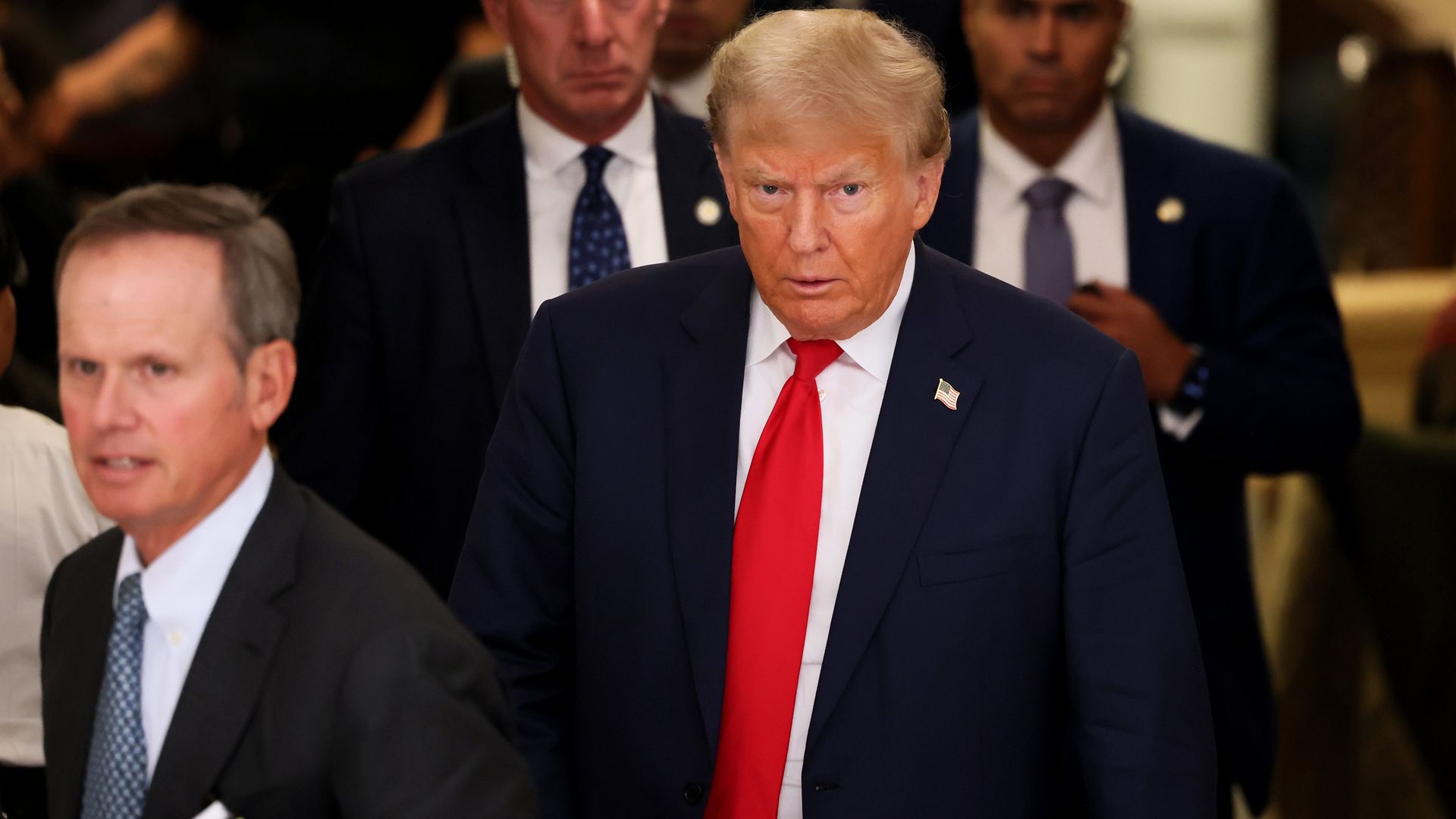 Former President Donald Trump leaves the courtroom for a lunch recess during the second day of his civil fraud trial at New York State Supreme Court on October 03, 2023 in New York Cit