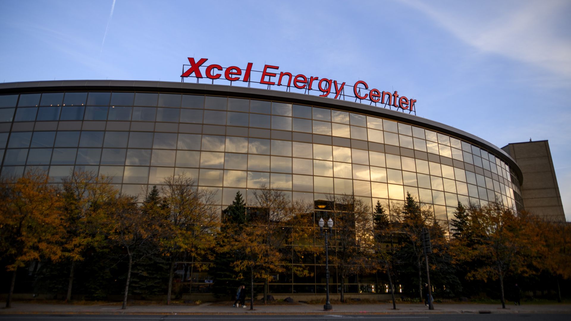 The exterior of the Xcel Energy Center, a hockey and concert arena, on a clear day under blue skies