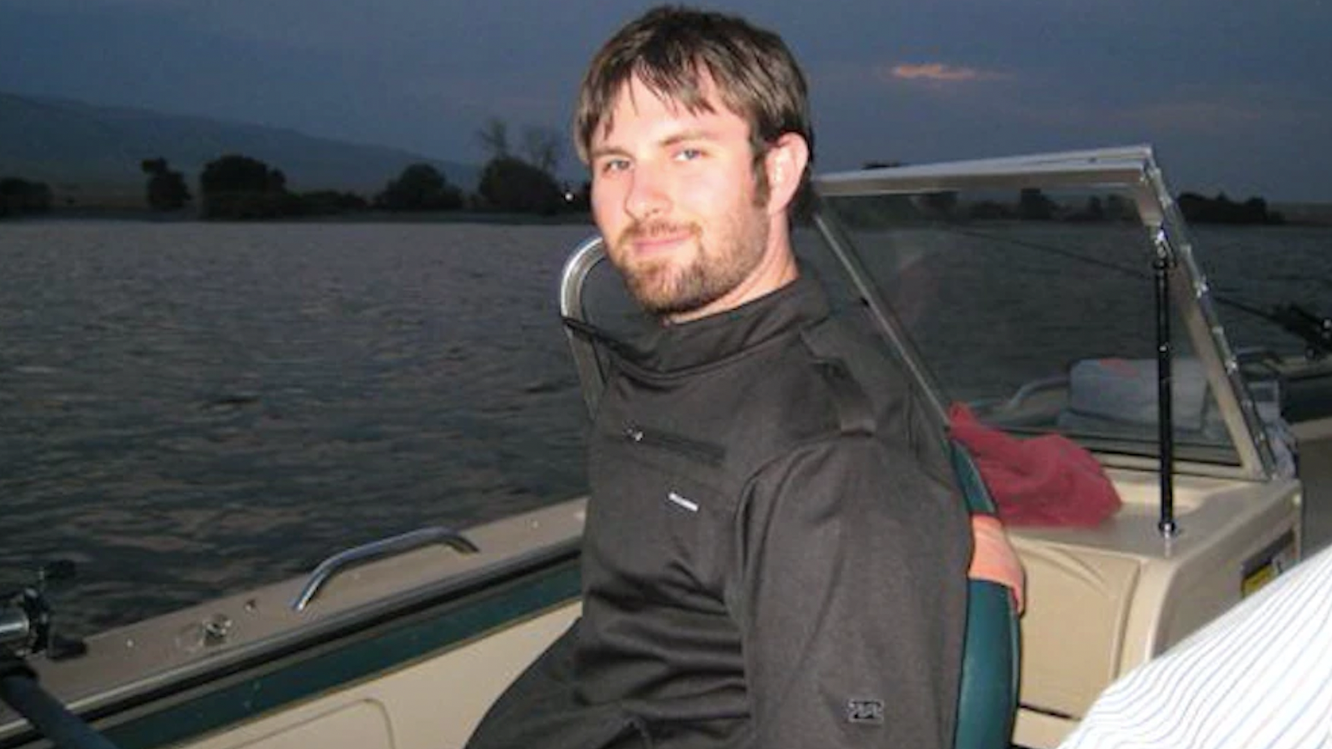A bearded young man on a boat