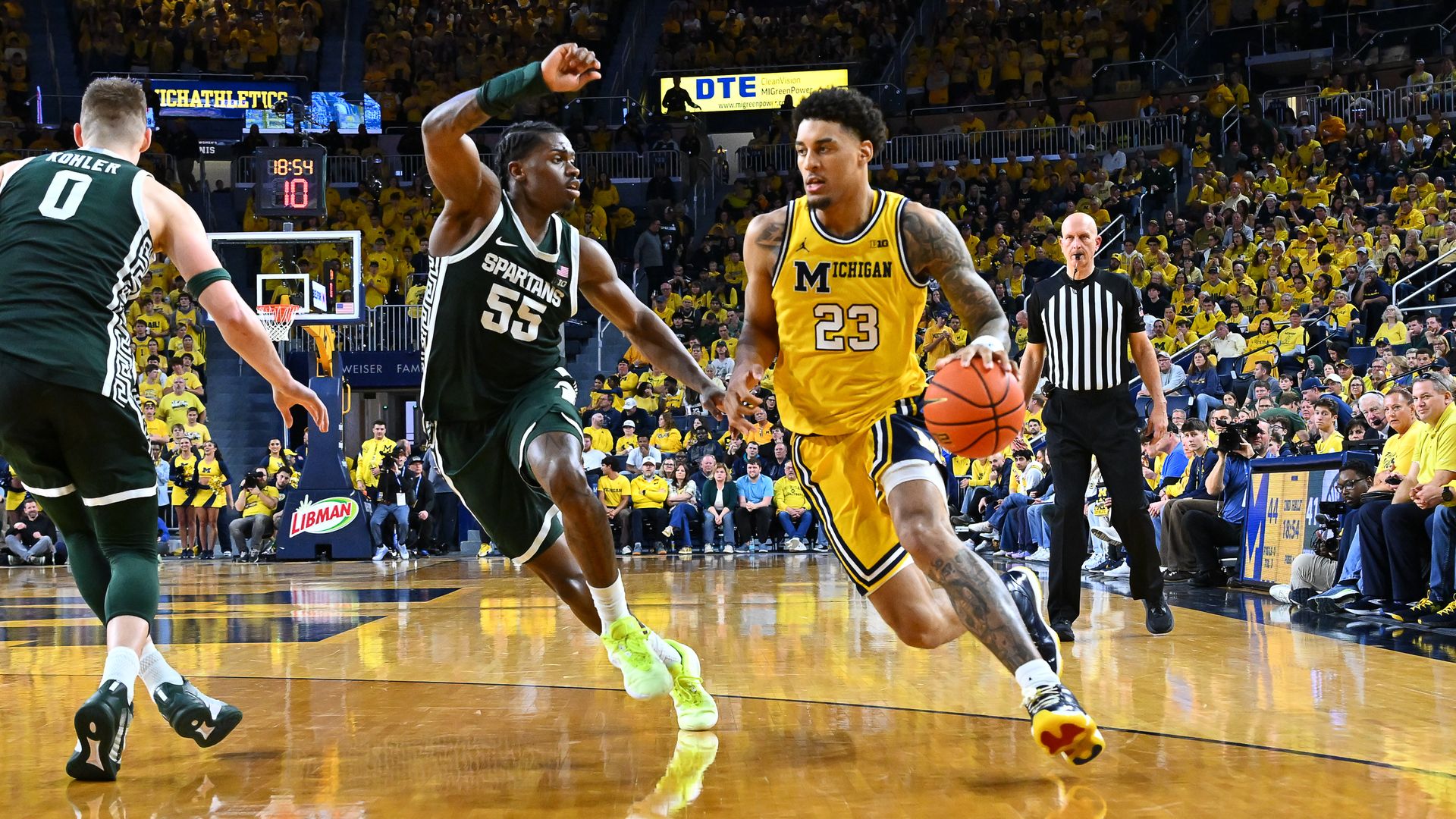 Michigan's Yaxel Lendeborg drives past Michigan State's Coen Carr this month. 