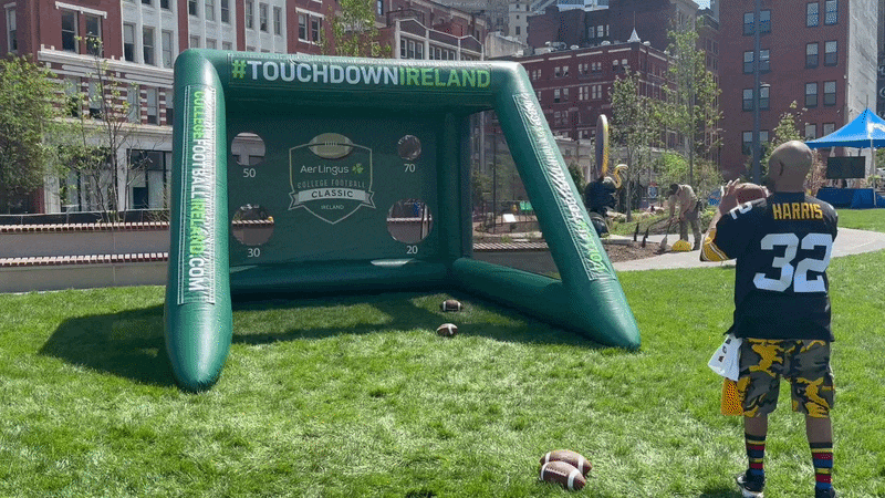 The vibe was chiller at Arts Landing, where fans could play games and relax in Pittsburgh's newest park. GIF: Ryan Deto/Axios