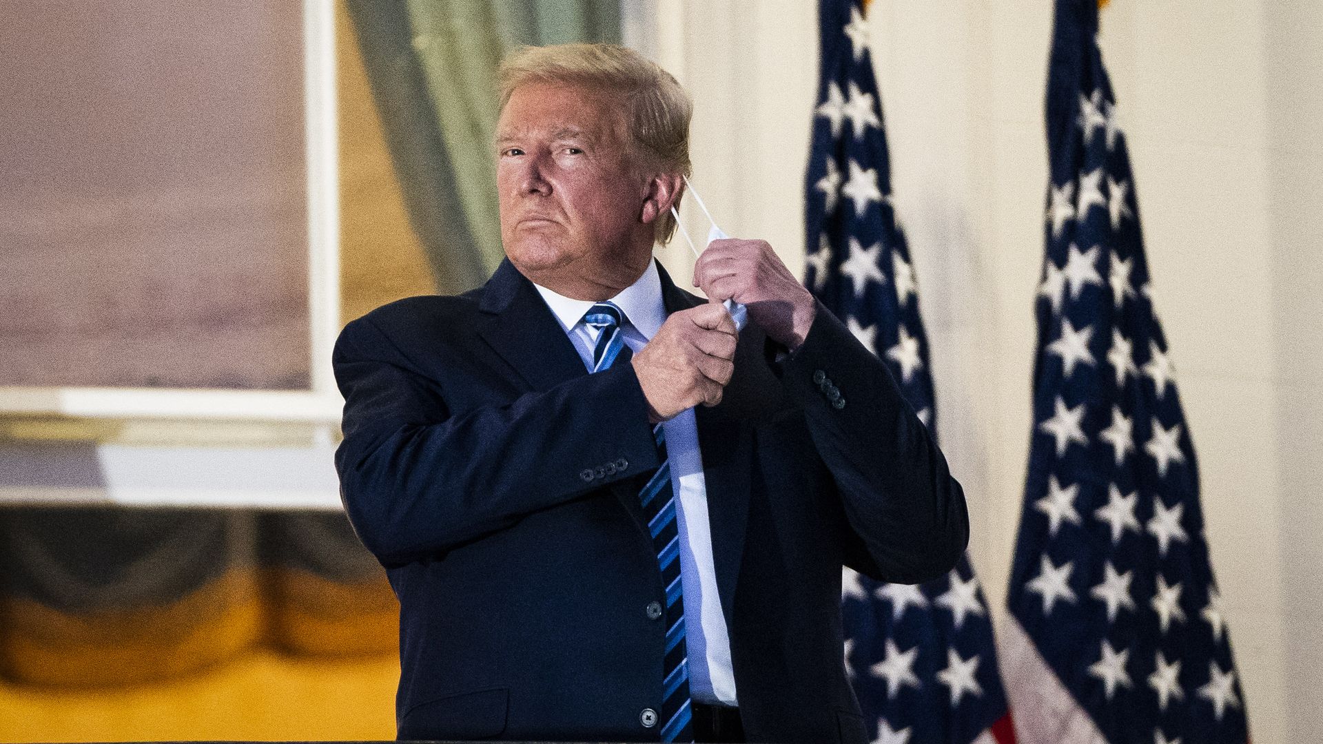 President Donald J. Trump watches Marine One from the Truman Balcony as he returns to the White House from Walter Reed Medical Center after receiving treatment for COVID.