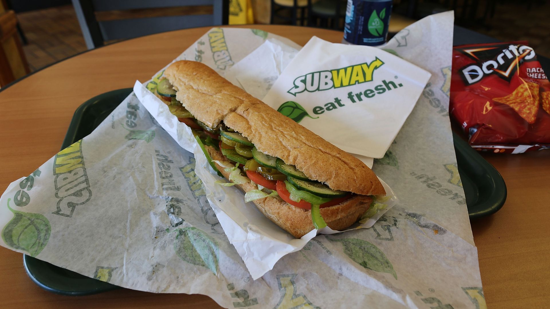 A tray with a sandwich from the Subway restaurant chain sits on a table.