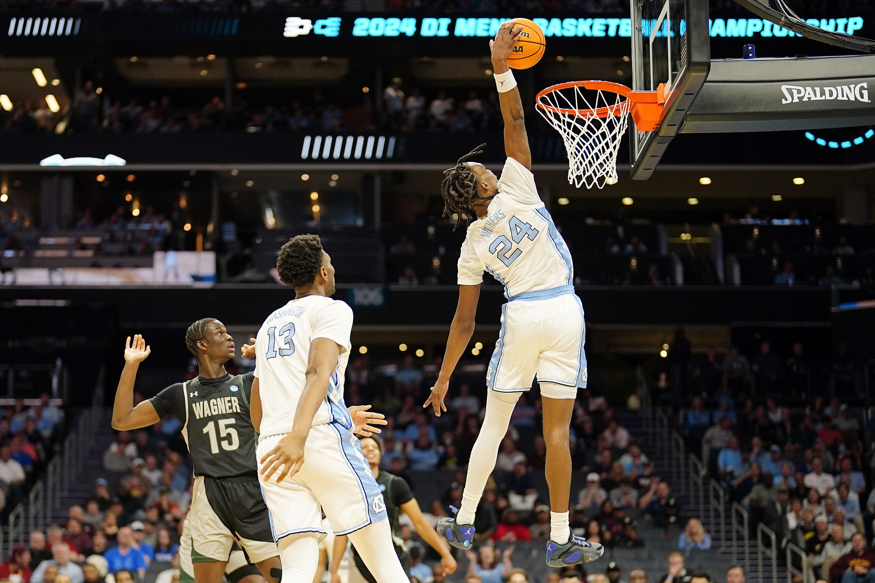 CHARLOTTE, NORTH CAROLINA - MARCH 21: Jae'Lyn Withers #24 of the North Carolina Tar Heels dunks the ball against the Wagner Seahawks during the second half in the first round of the NCAA Men's Basketball Tournament at Spectrum Center on March 21, 2024 in Charlotte, North Carolina. (Photo by Jacob Kupferman/Getty Images)