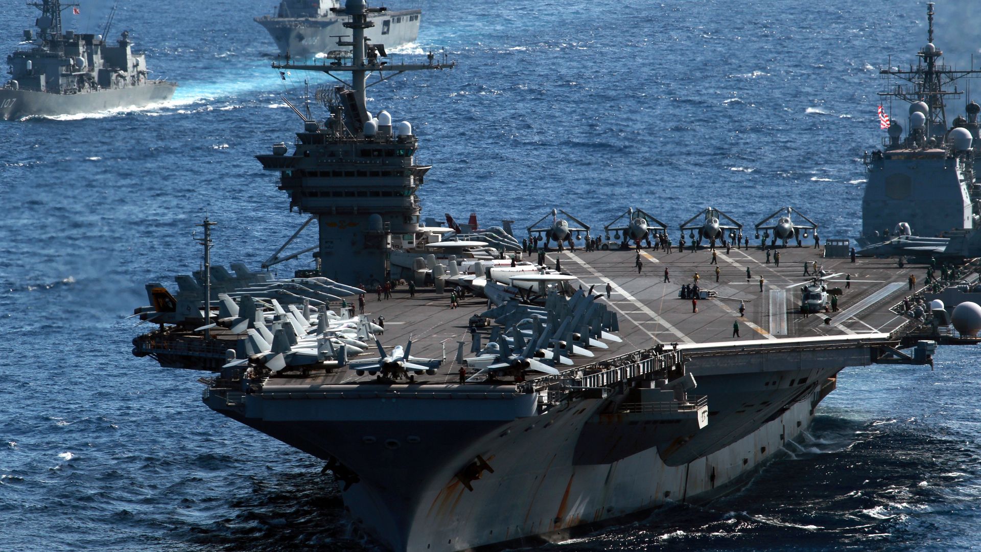 US aircraft carrier USS George Washington sails among US and Japanese warships during the Keen Sword US-Japan military exercises in the Pacific Ocean on December 10, 2010.