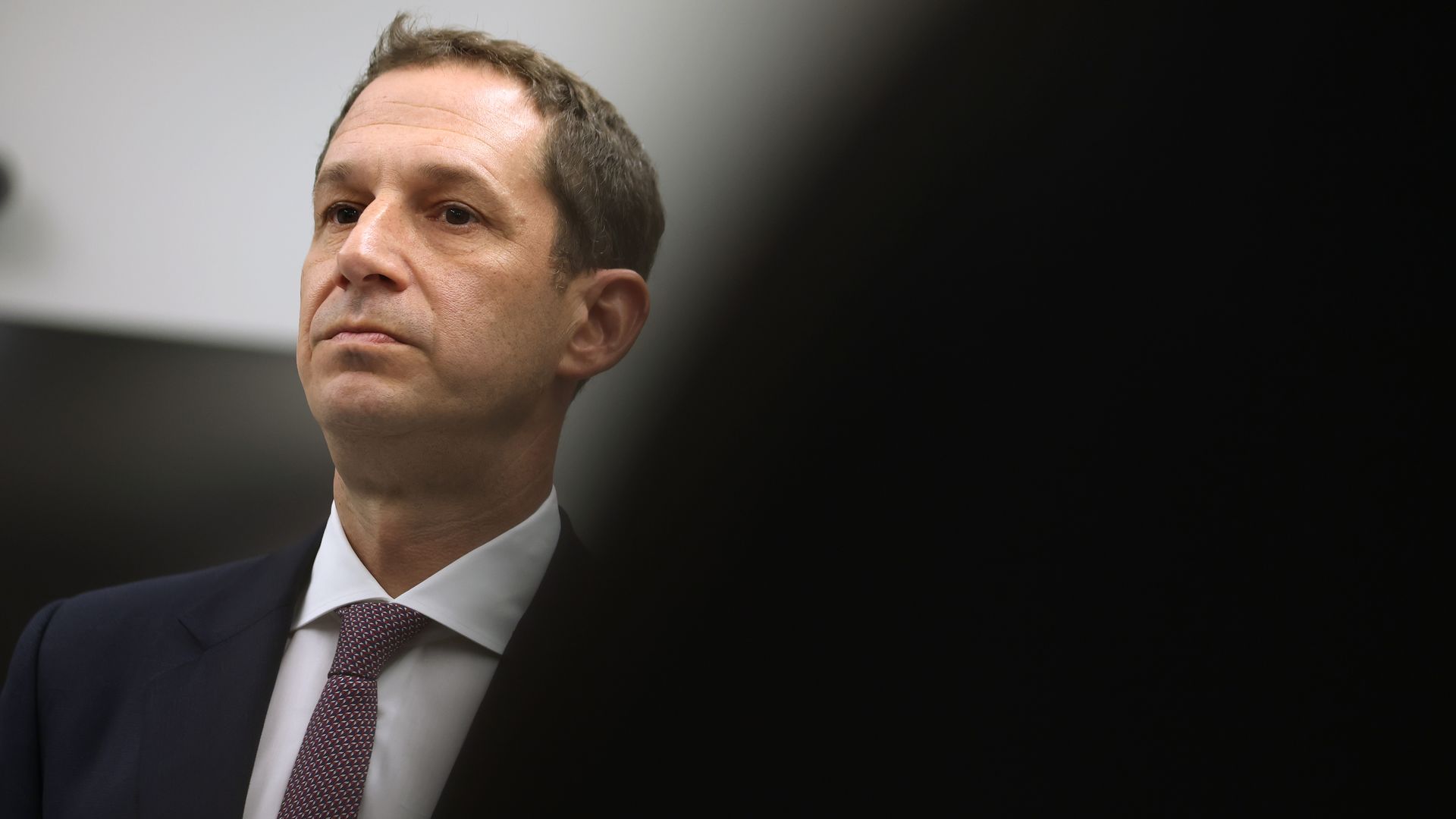 Photo of Daniel Lurie looking into the distance