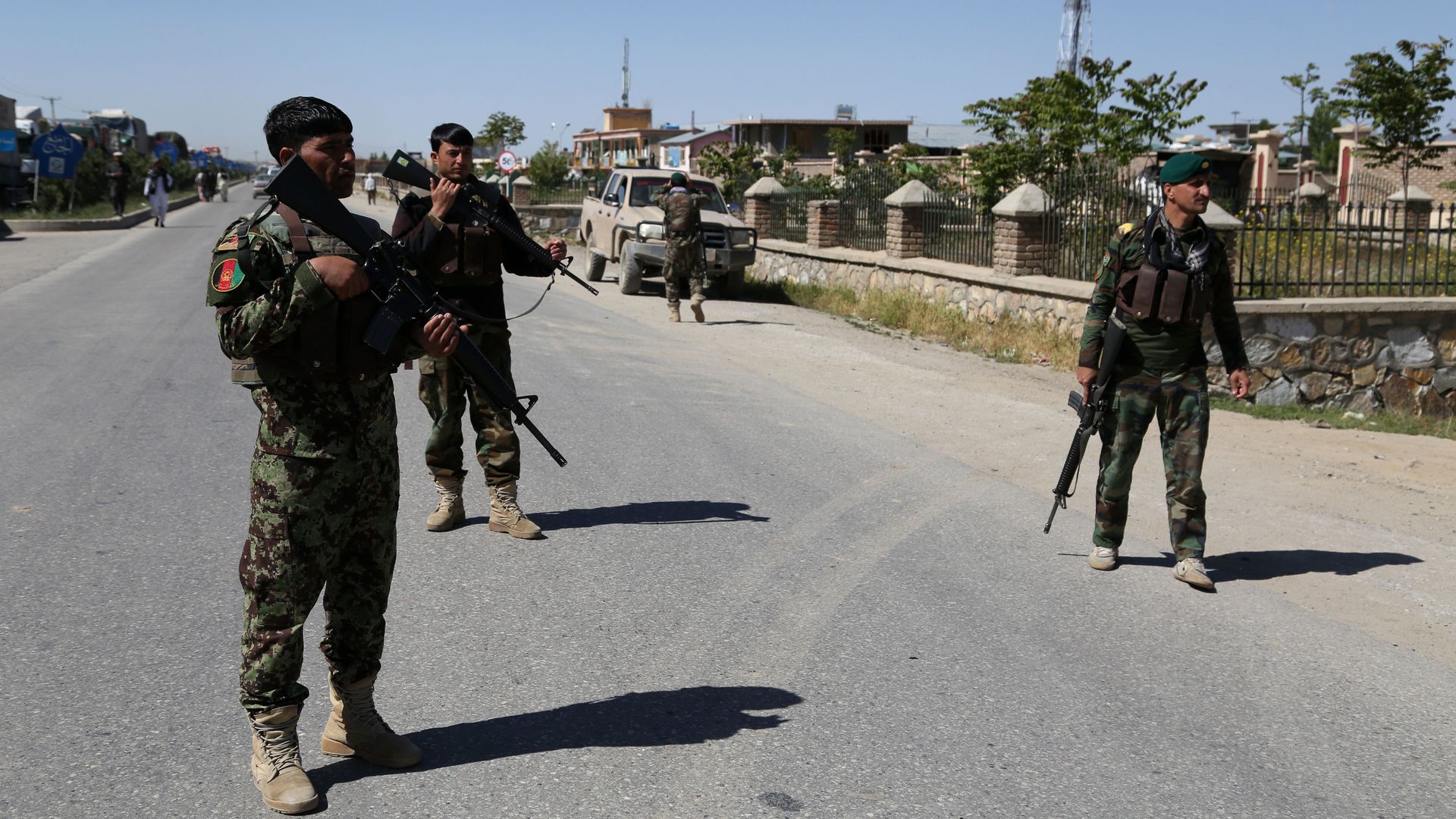 Afghan security personnel standing guard after a car bombing in Ghazni in May.
