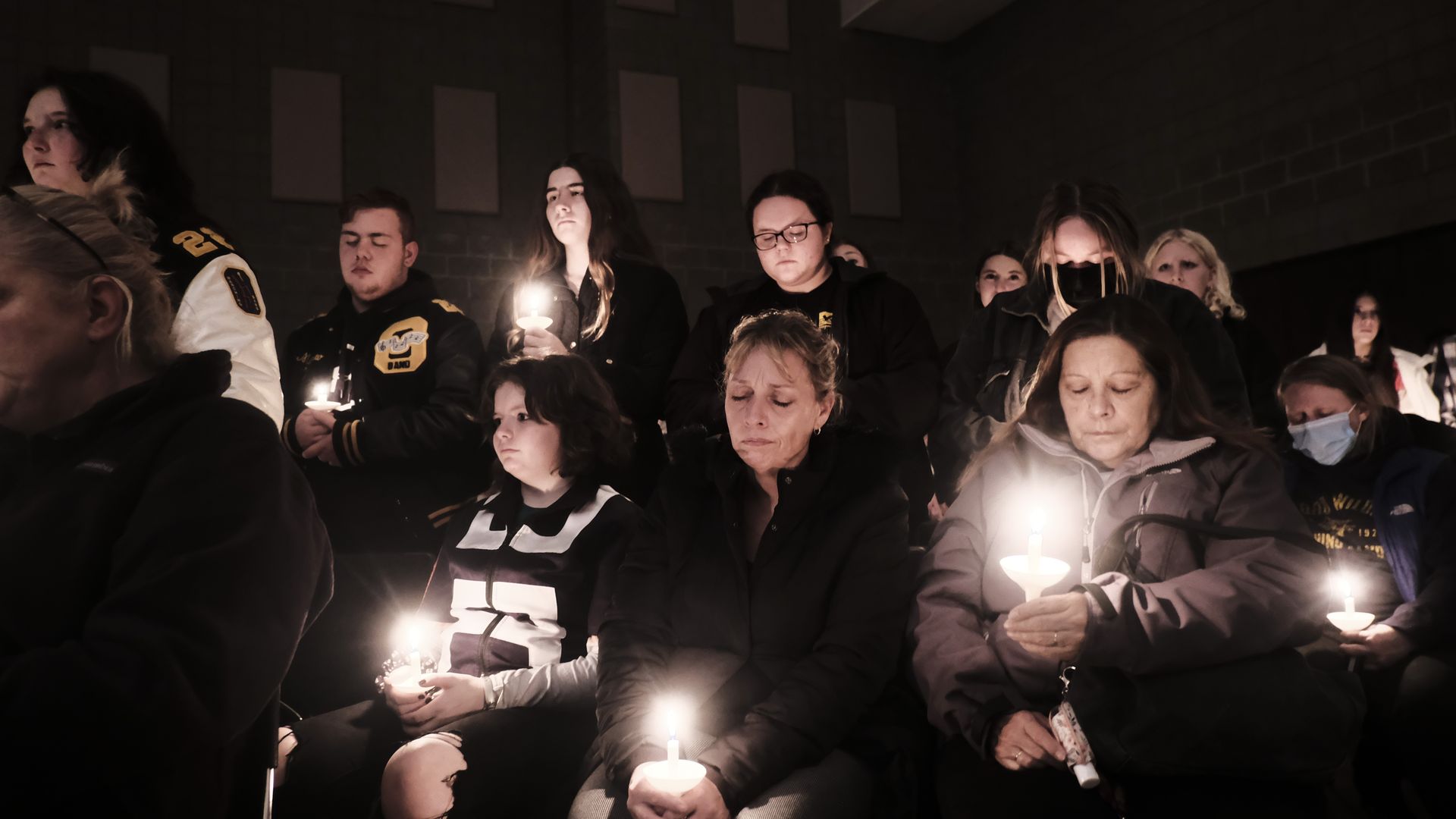 Students, parents, teachers, and community members gather for a vigil at the Lake Point Community Church following a shooting at Oxford High School on November 30, 2021 in Oxford, Michigan