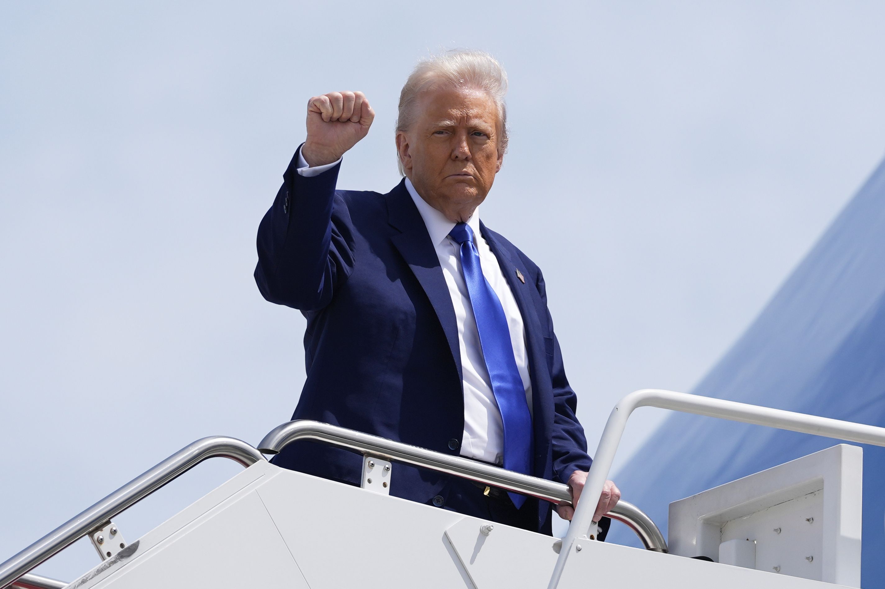President Donald Trump boards Air Force One, Monday, May 12, 2025, at Joint Base Andrews, Md. (AP Photo/Alex Brandon)