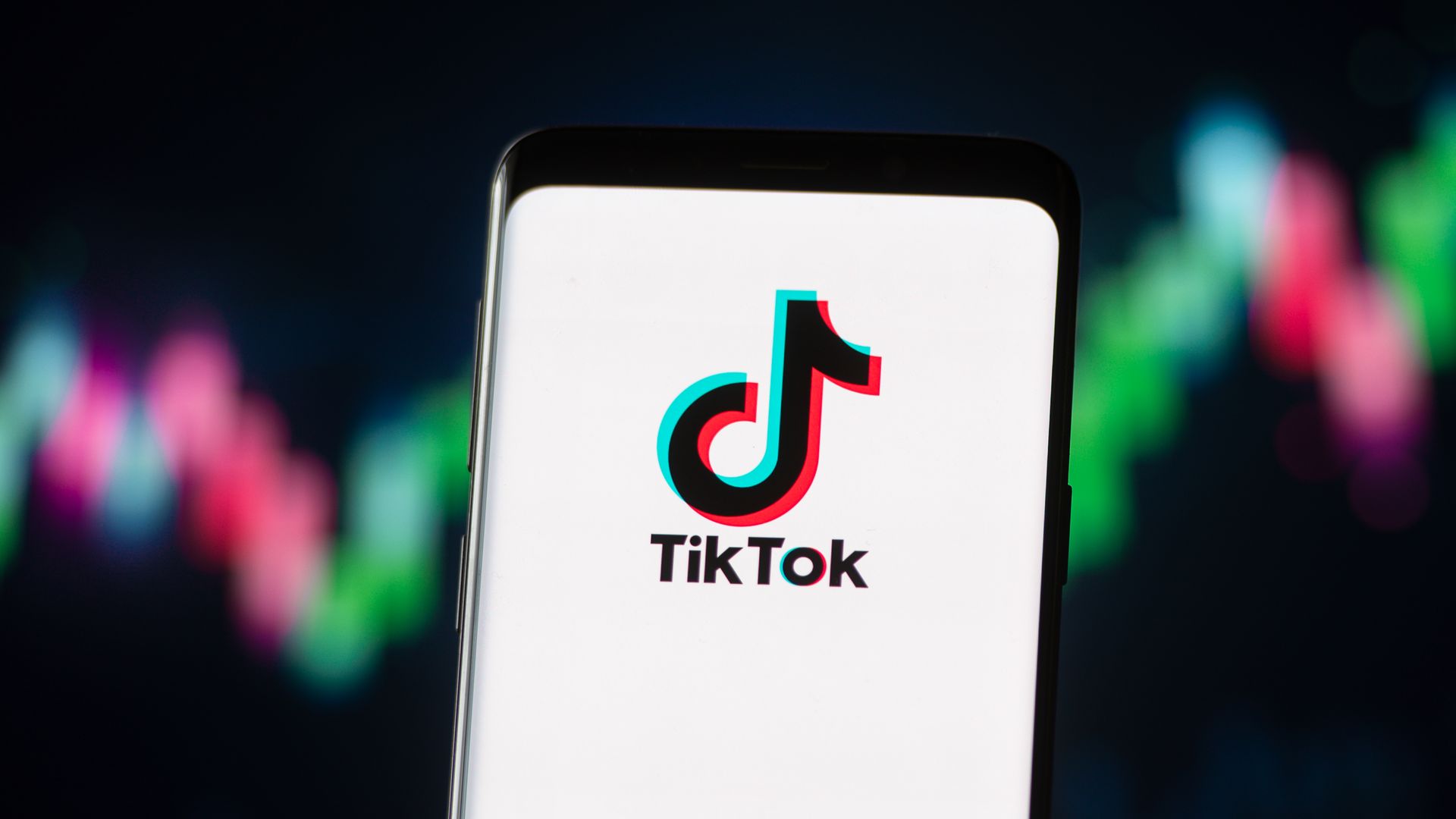 Photo illustration of the TikTok logo displayed on a smartphone