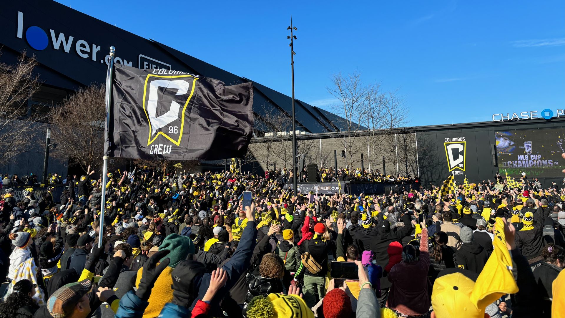 A crowd of Crew fans cheering in the plaza outside Lower.com Field