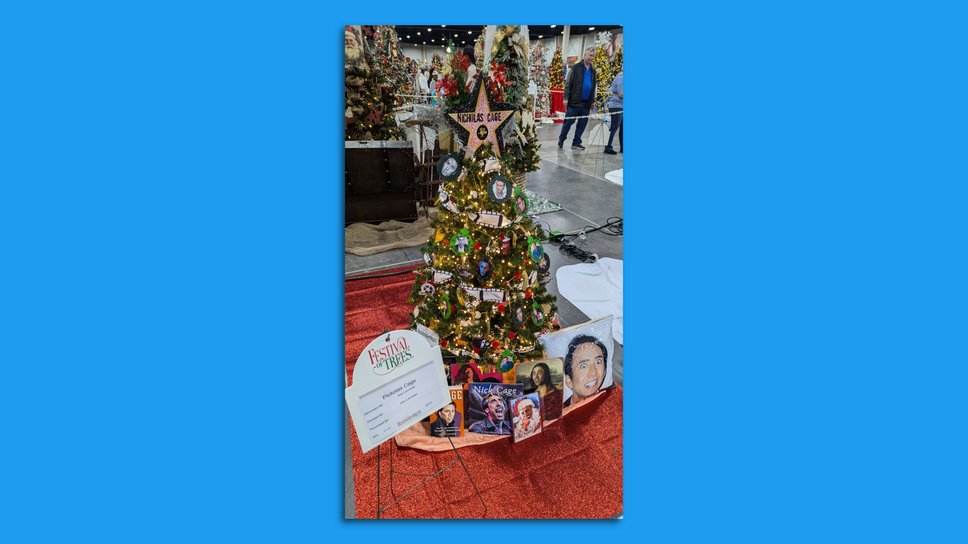A christmas tree with nicolas cage photos