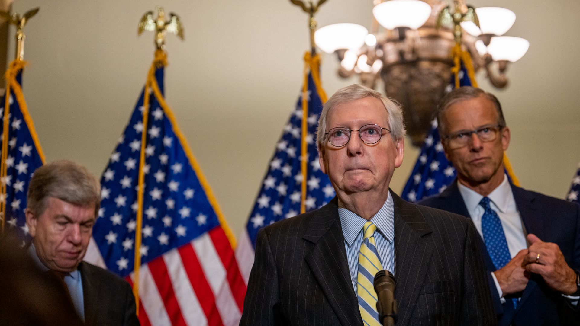 Mitch McConnell at a lectern