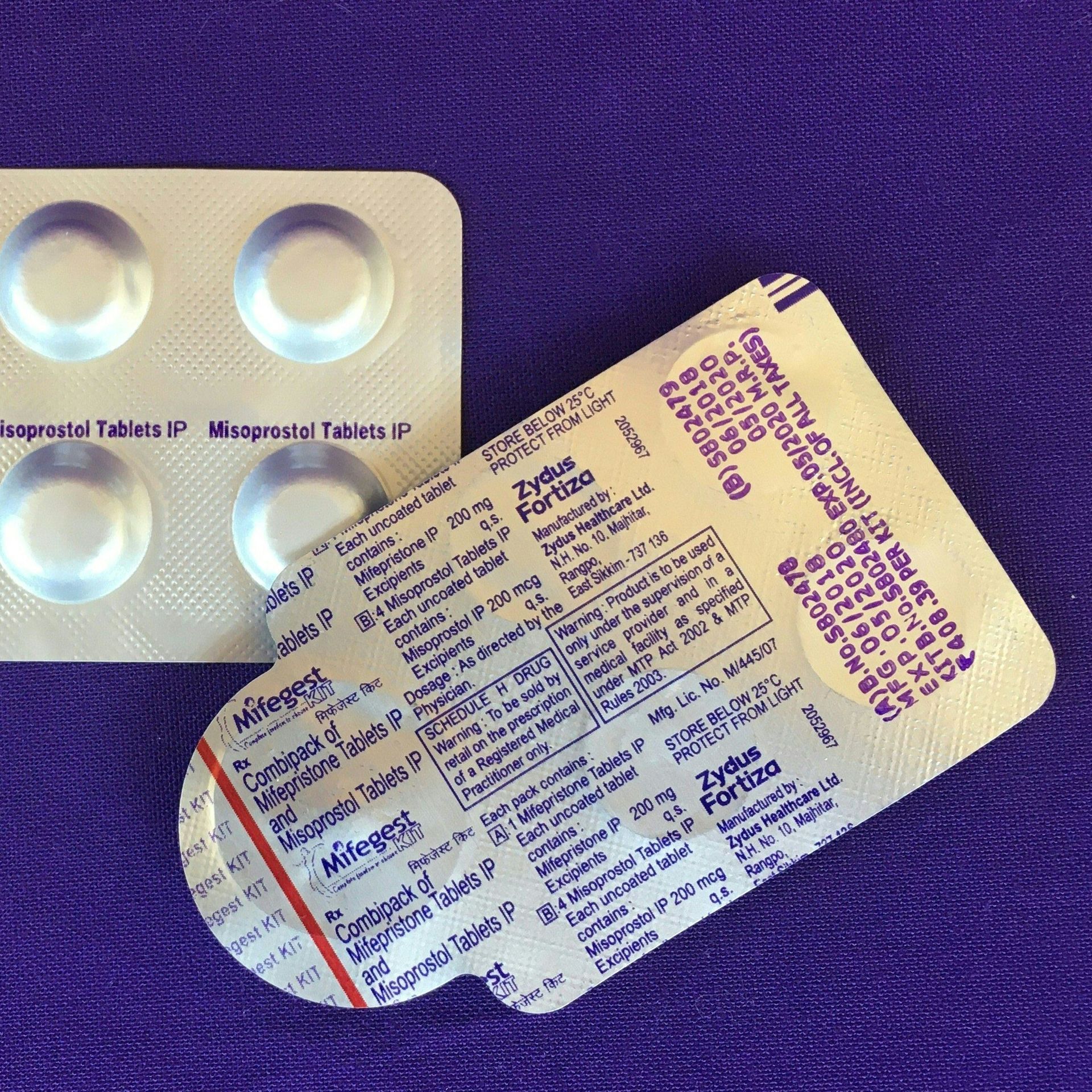 Photo of two two slides of pills