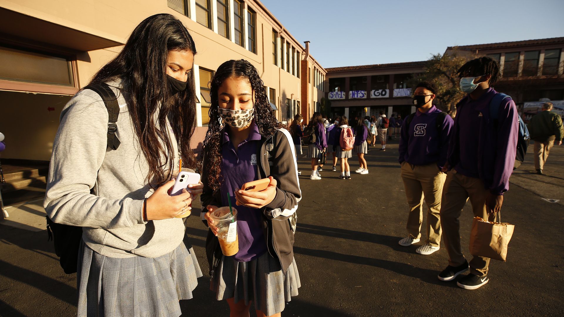 enior students Samantha Ashworth talk to their mothers on their phone as they return to campus for in-person instruction.