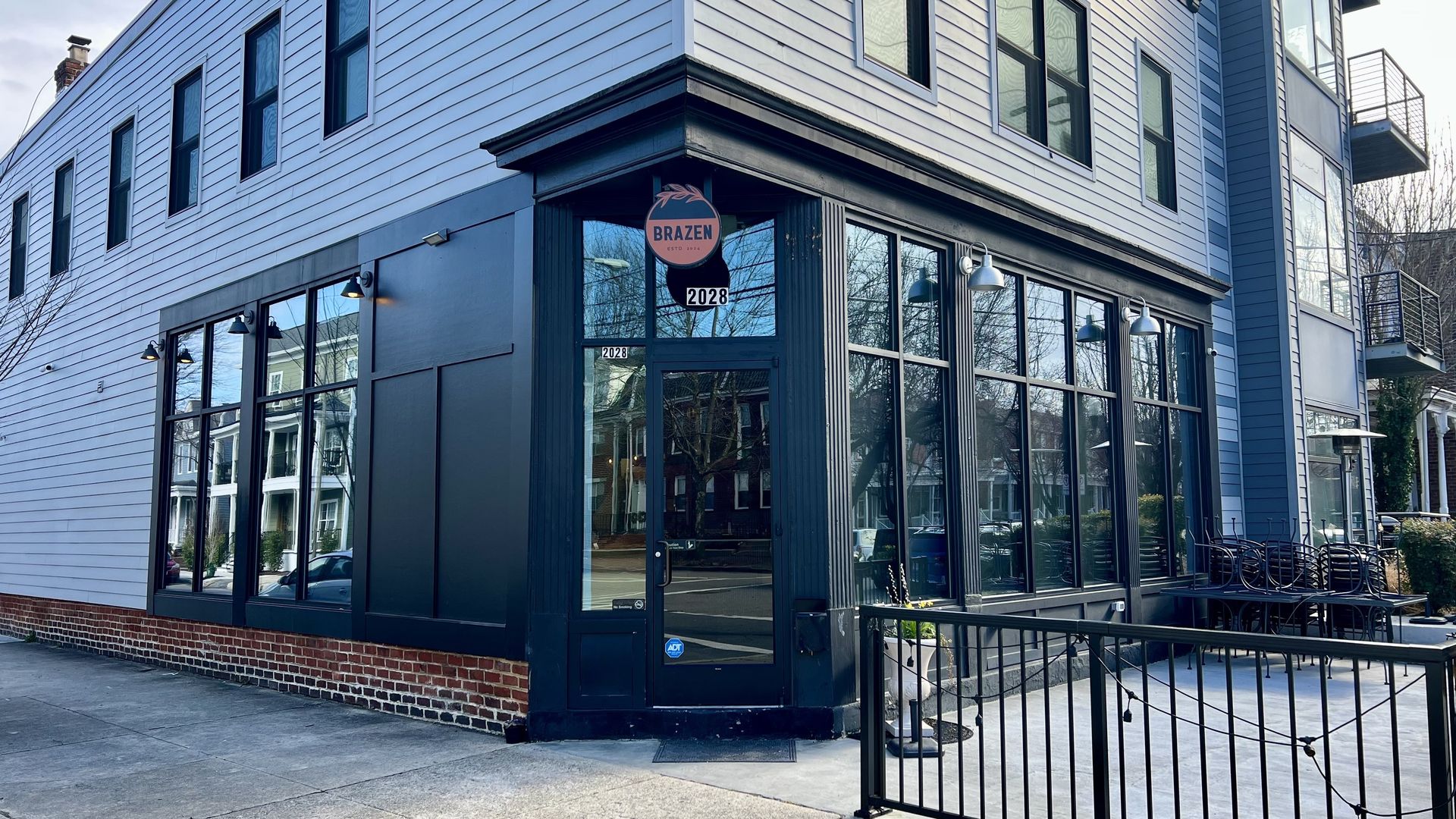 the outside of a blue and gray restaurant building 