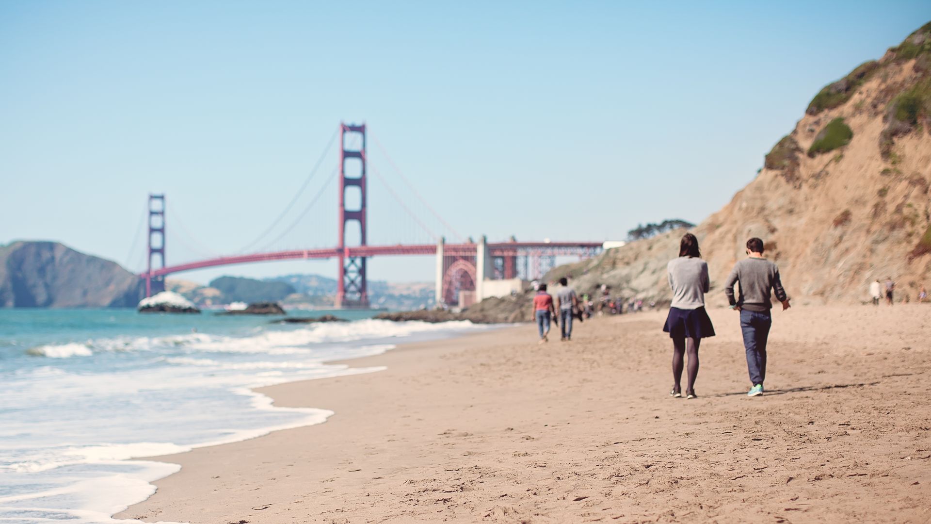 People walking along the beach