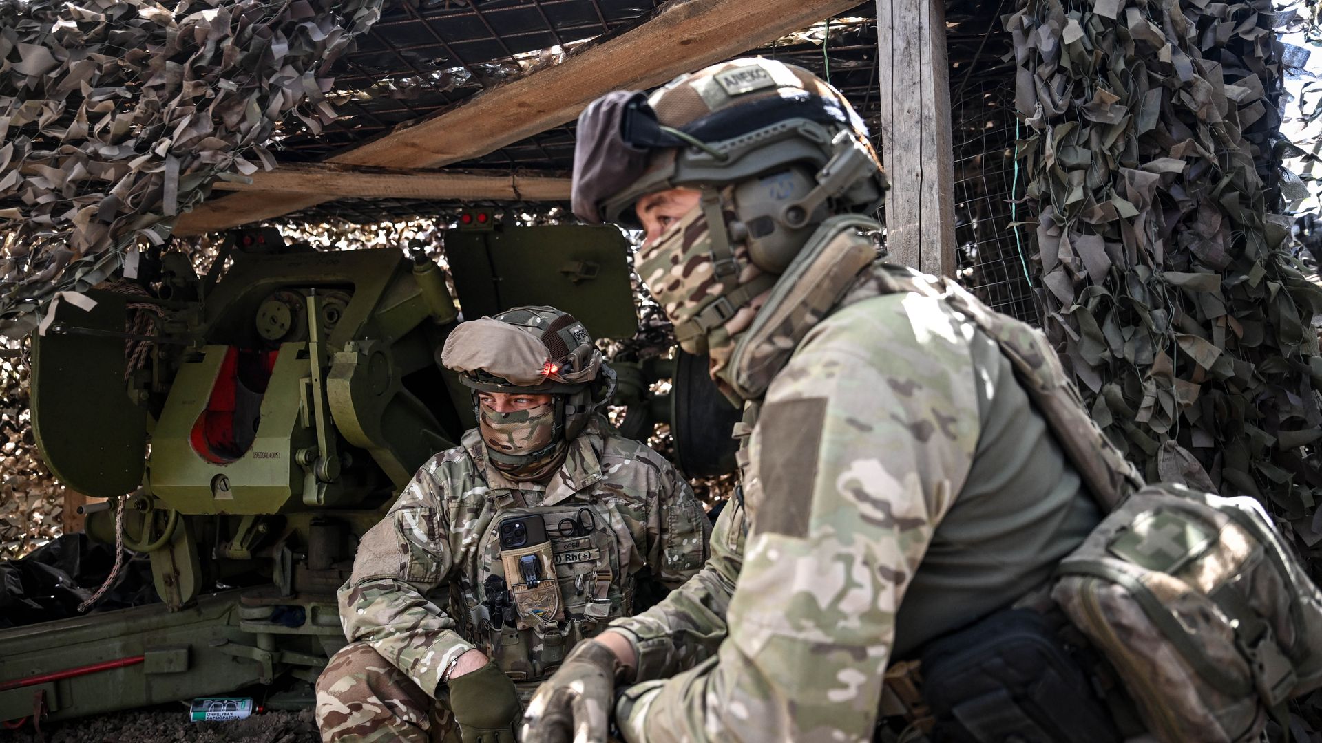 Soldiers from the artillery crew of the Striletskyi Special Forces Police Battalion of the Main Department of the National Police in the Zaporizhzhia region prepare for a combat mission in the Zaporizhzhia region, Ukraine, on May 23, 2025.
