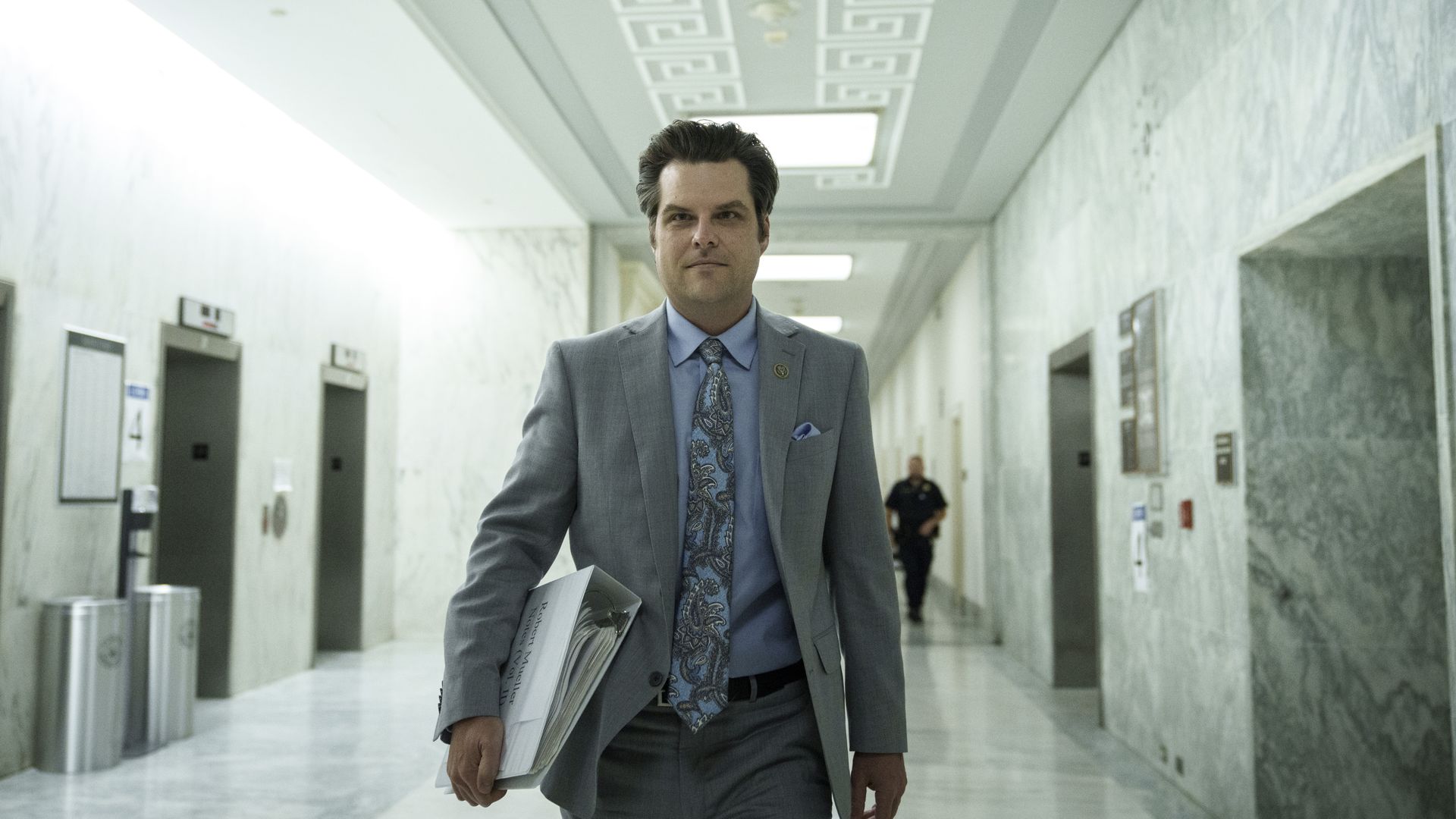 Rep. Matt Gaetz is seen walking down a hall in Congress.