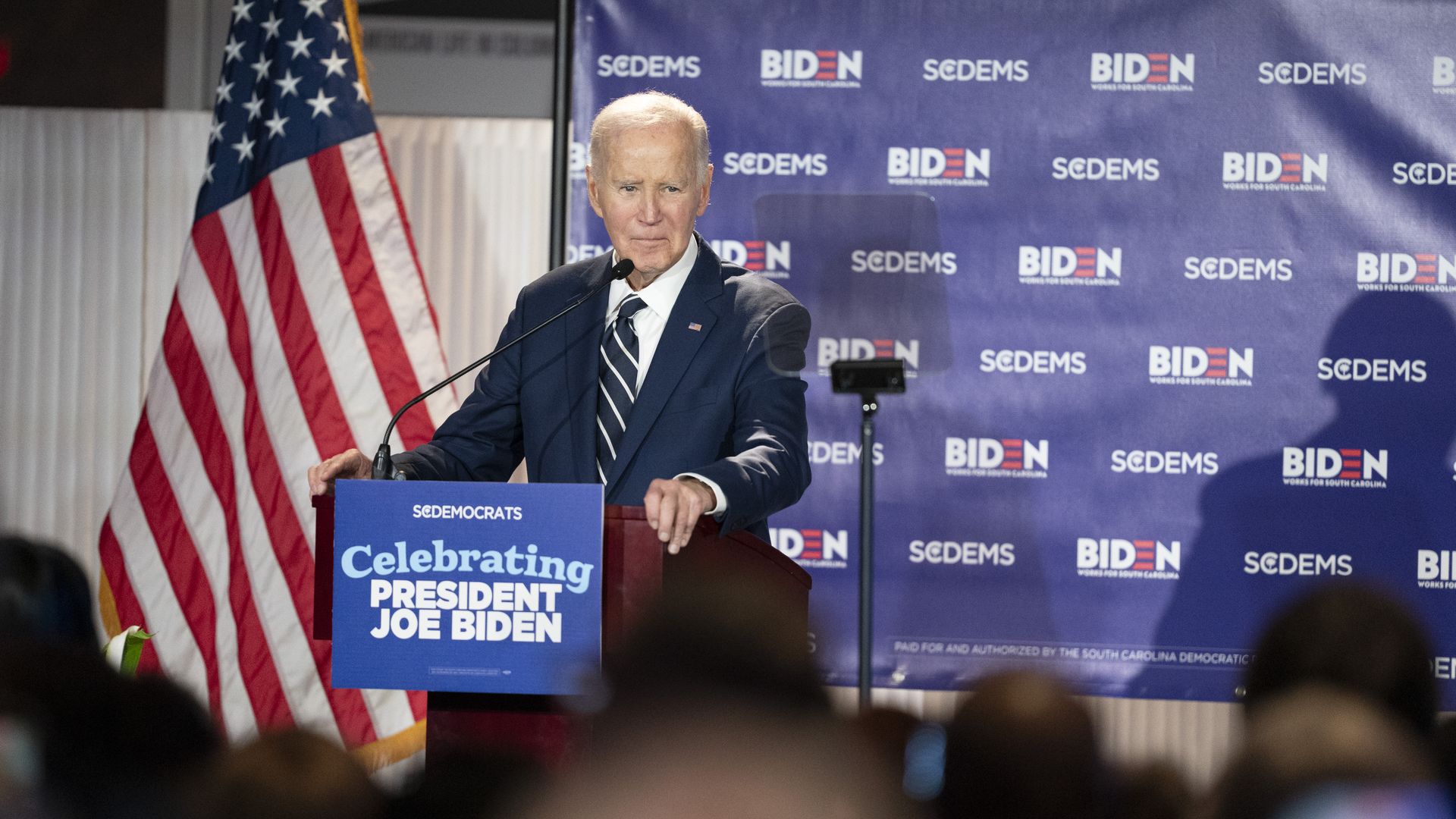 Former President Joe Biden speaks at a podium during a South Carolina Democratic Party fundraising event at the Columbia Museum of Art in Columbia, South Carolina.
