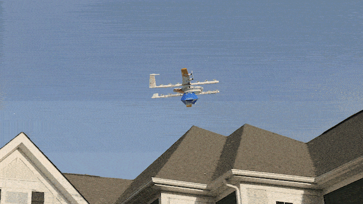 Image shows a drone dropping a Walmart package at a house.